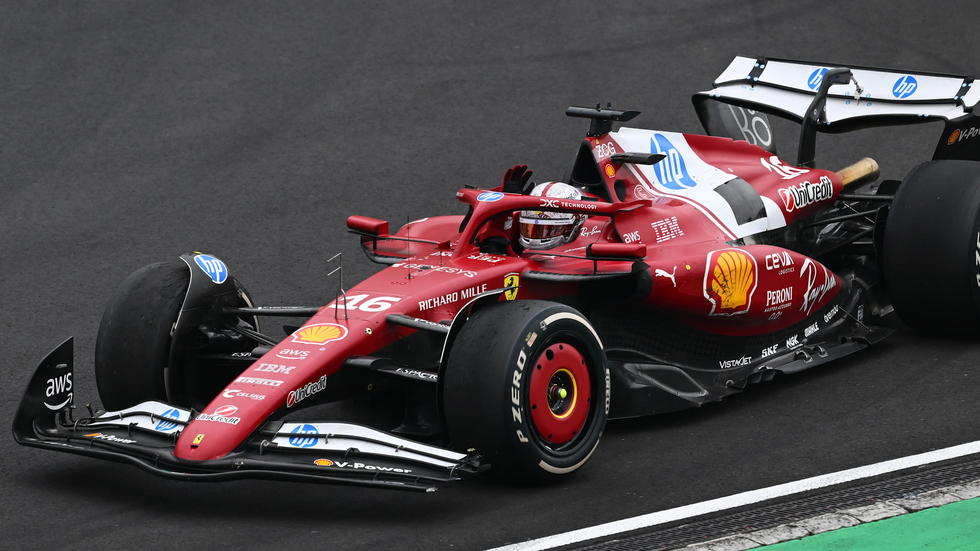 SHANGHAI, CHINA - MARCH 23: Charles Leclerc of Monaco driving the (16) Scuderia Ferrari SF-25 waves