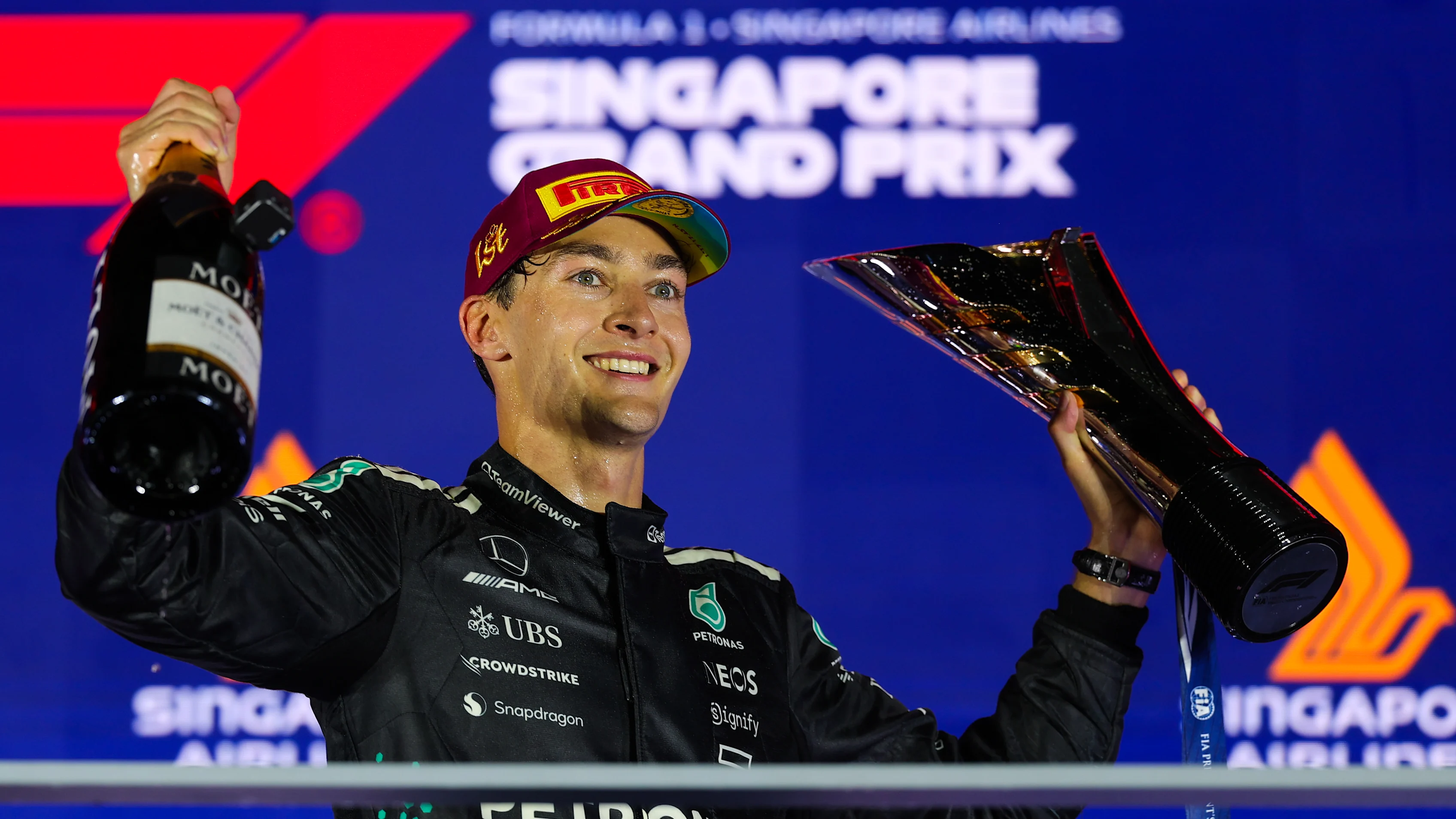 SINGAPORE, SINGAPORE - OCTOBER 05: Race winner George Russell of Great Britain and Mercedes AMG