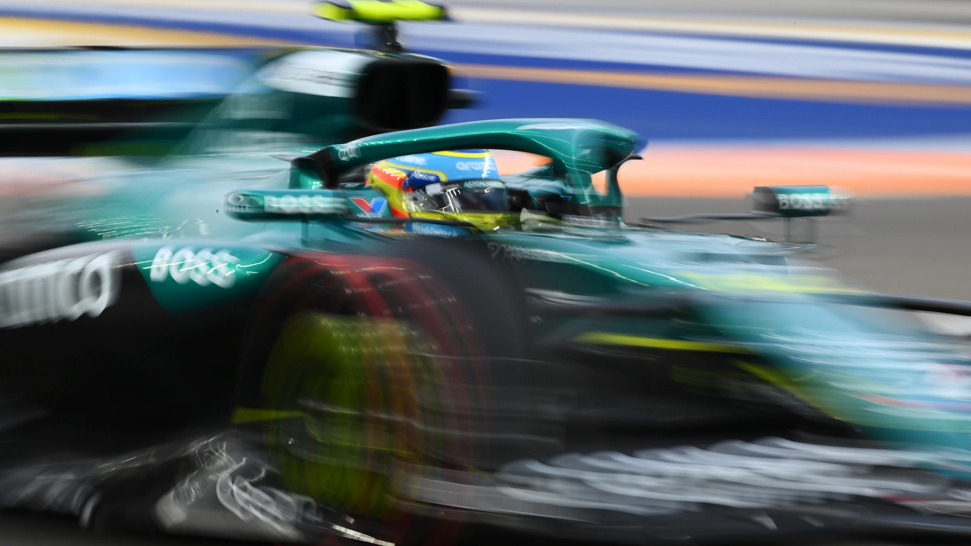SINGAPORE, SINGAPORE - OCTOBER 03: Fernando Alonso of Spain driving the (14) Aston Martin F1 Team
