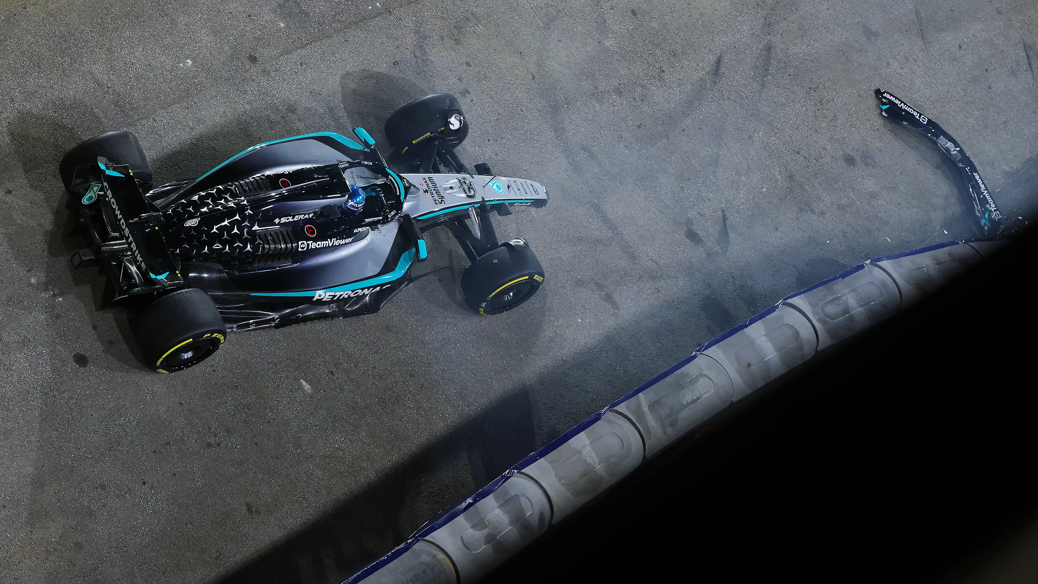 SINGAPORE, SINGAPORE - OCTOBER 03: George Russell of Great Britain driving the (63) Mercedes AMG