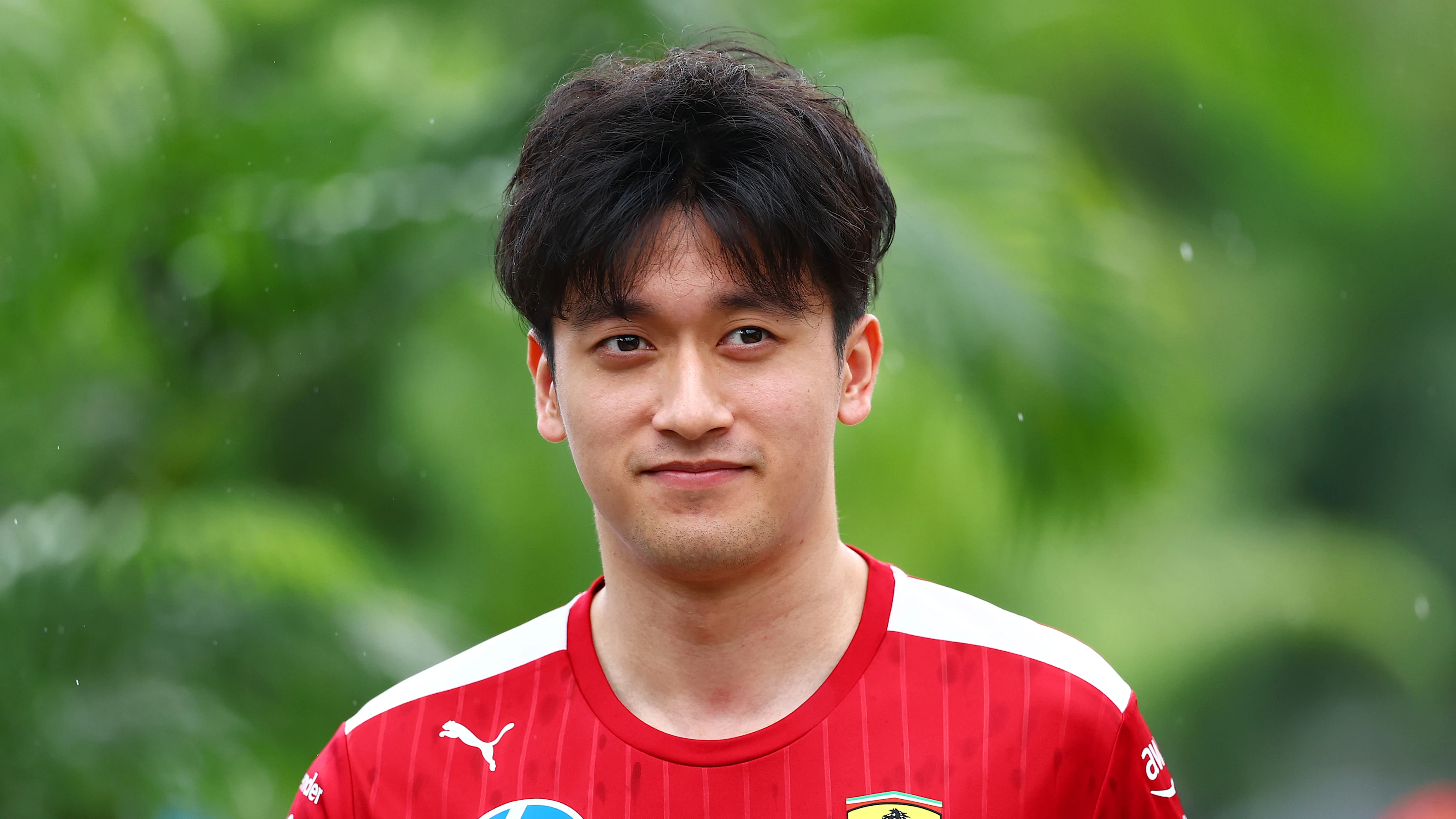 SINGAPORE, SINGAPORE - OCTOBER 02: Zhou Guanyu of China and Scuderia Ferrari arrives in the Paddock