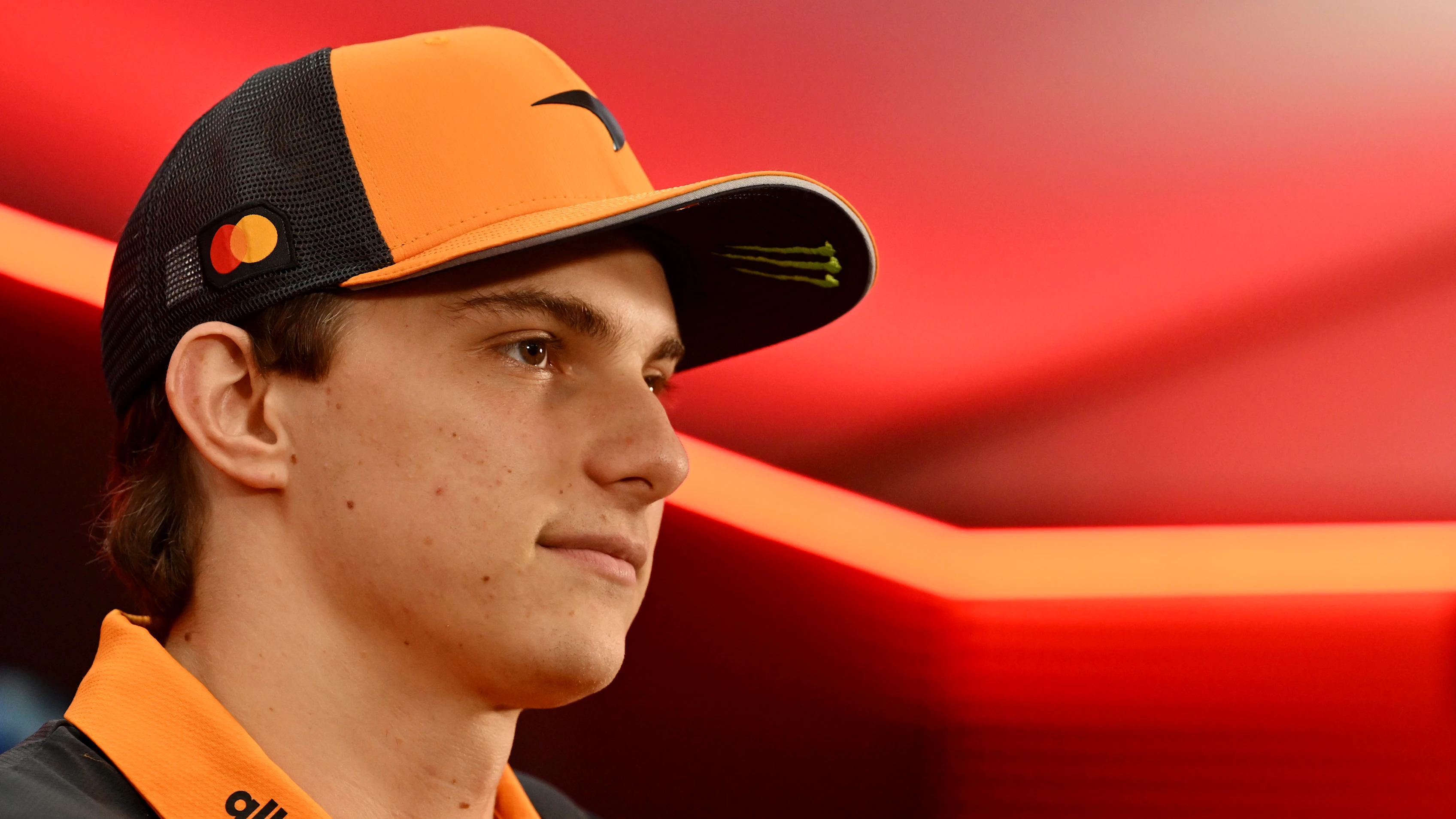 SINGAPORE, SINGAPORE - OCTOBER 02: Oscar Piastri of Australia and McLaren talks to the media during