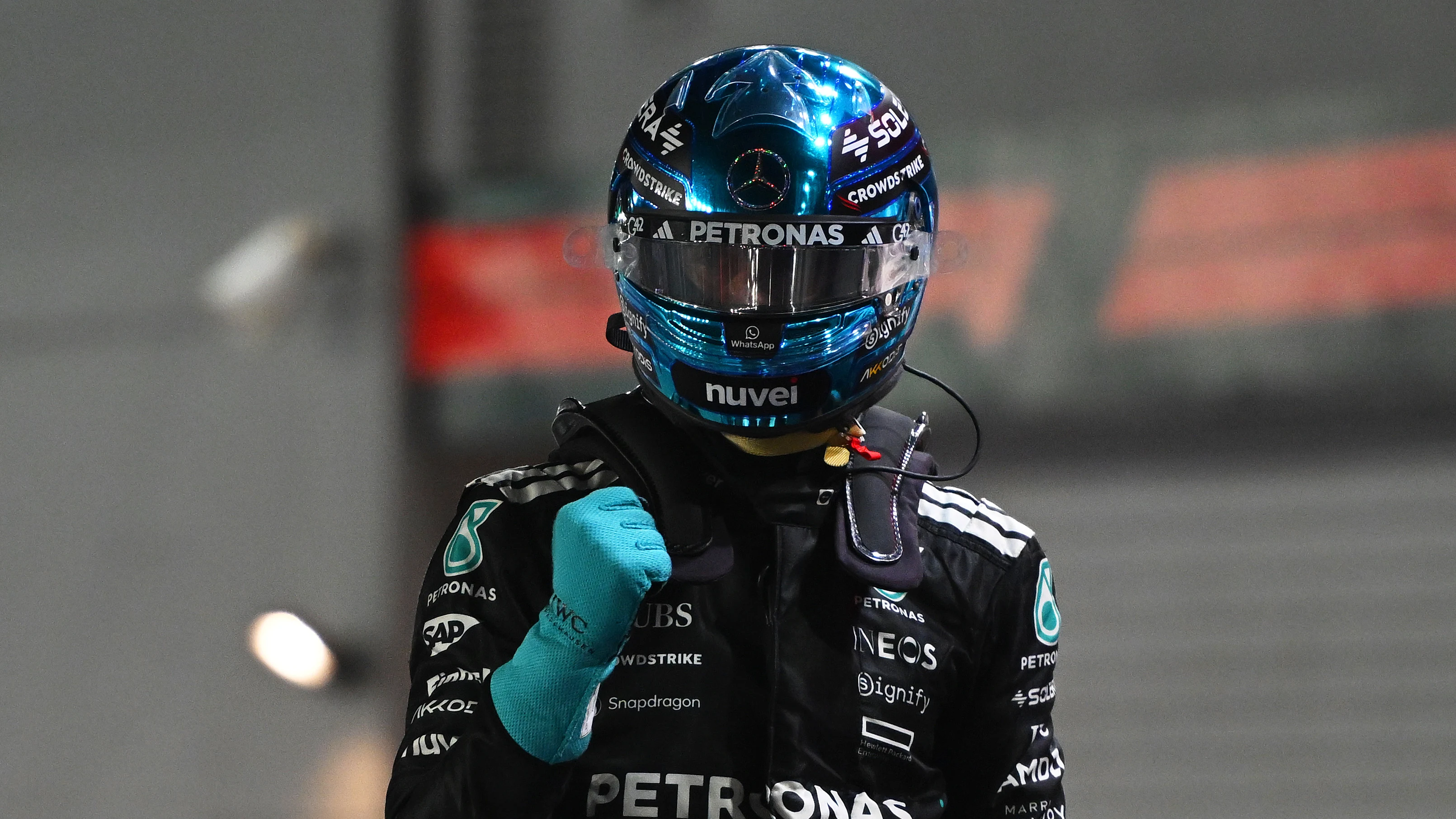 SINGAPORE, SINGAPORE - OCTOBER 04: Pole position qualifier George Russell of Great Britain and