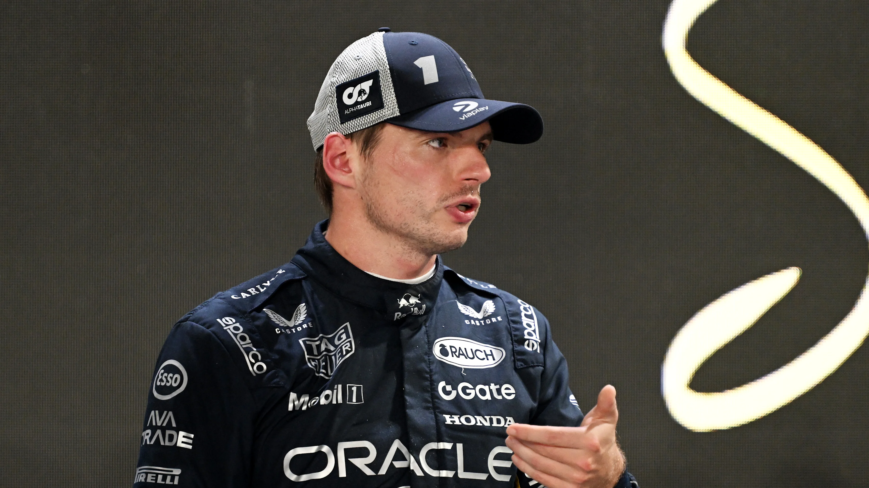 SINGAPORE, SINGAPORE - OCTOBER 04: Second placed qualifier Max Verstappen of the Netherlands and