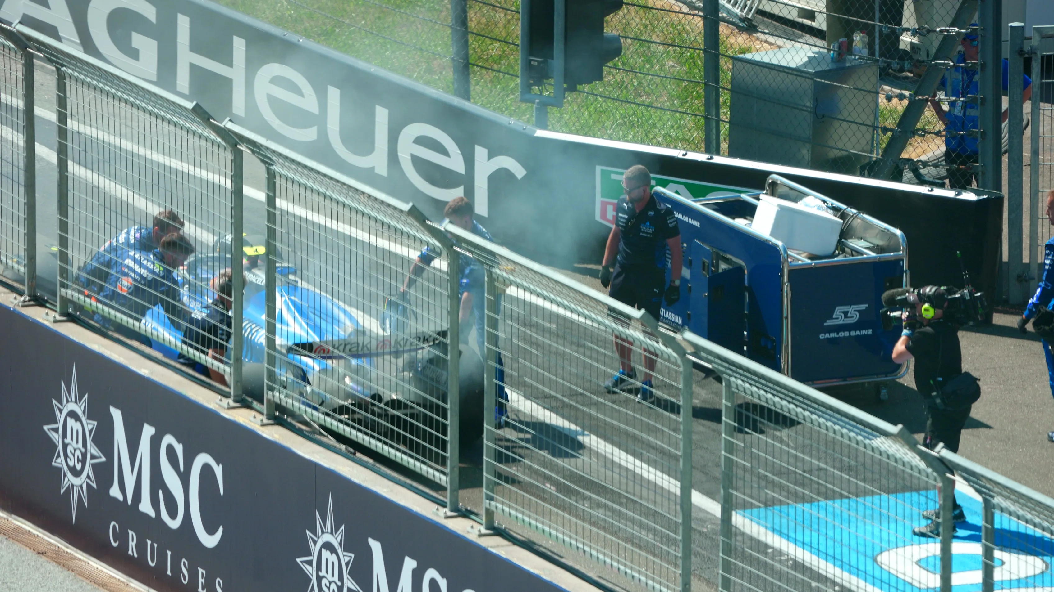 SPIELBERG, AUSTRIA - JUNE 29: Carlos Sainz of Spain driving the (55) Williams FW47 Mercedes catches fire in the Pitlane during the F1 Grand Prix of Austria at Red Bull Ring on June 29, 2025 in Spielberg, Austria. (Photo by Malcolm Griffiths - Formula 1/Formula 1 via Getty Images)