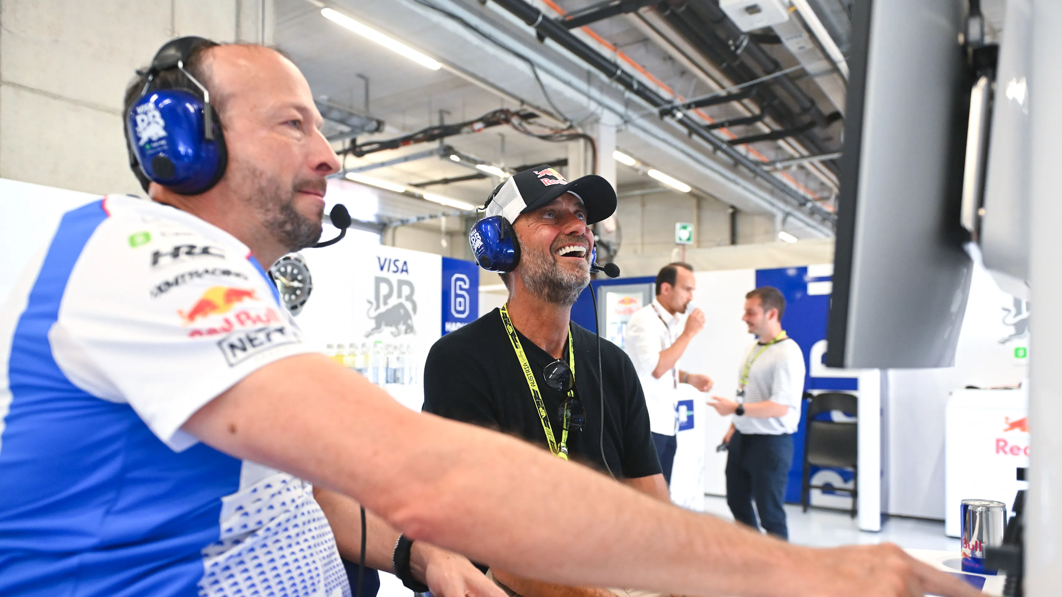 Jurgen Klopp looked to be enjoying the action as he watched on with Racing Bulls' Peter Bayer