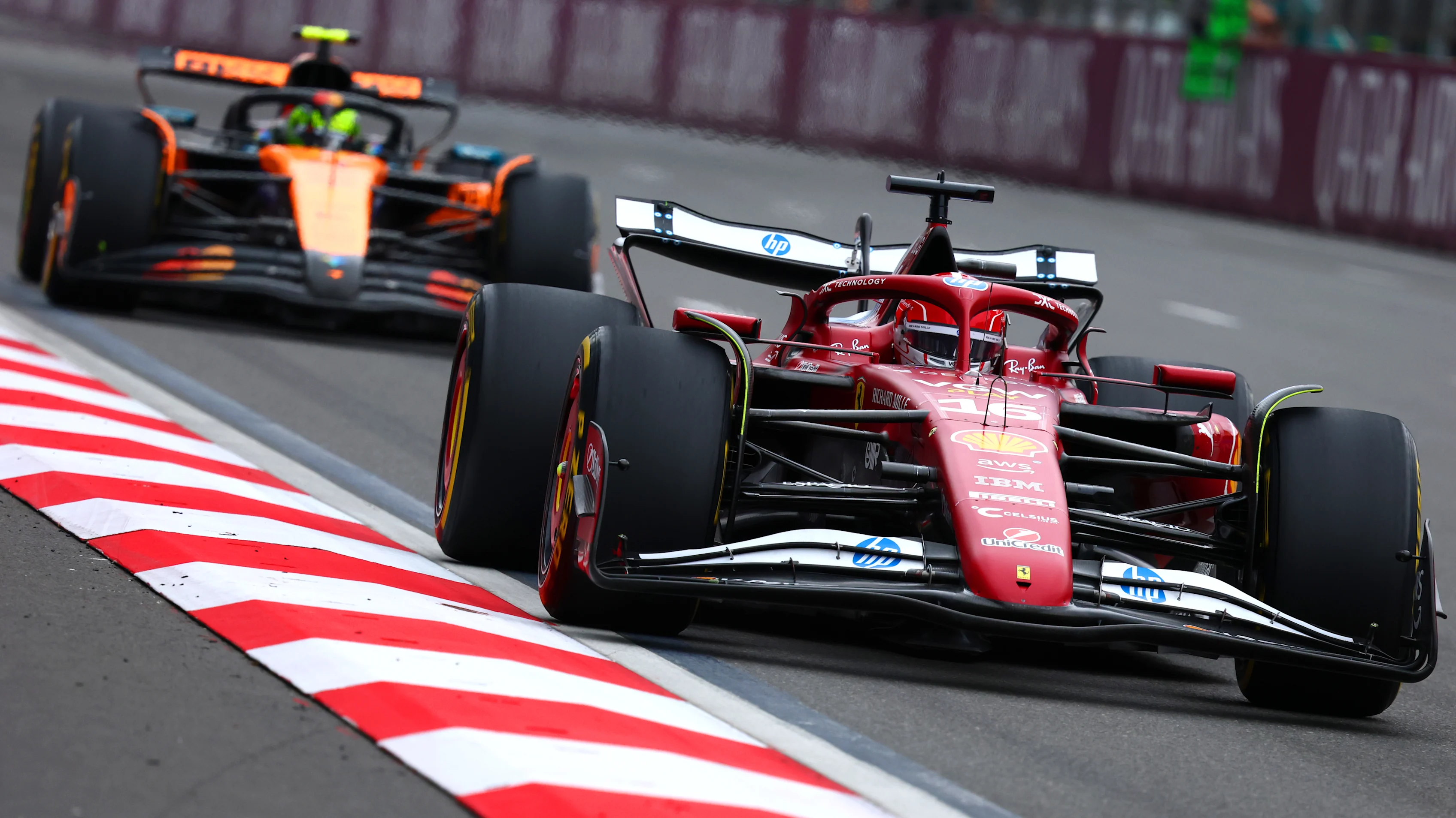 BAKU, AZERBAIJAN - SEPTEMBER 21: Charles Leclerc of Monaco driving the (16) Scuderia Ferrari SF-25 leads Lando Norris of Great Britain driving the (4) McLaren MCL39 Mercedes on track during the F1 Grand Prix of Azerbaijan at Baku City Circuit on September 21, 2025 in Baku, Azerbaijan. (Photo by Clive Rose/Getty Images)