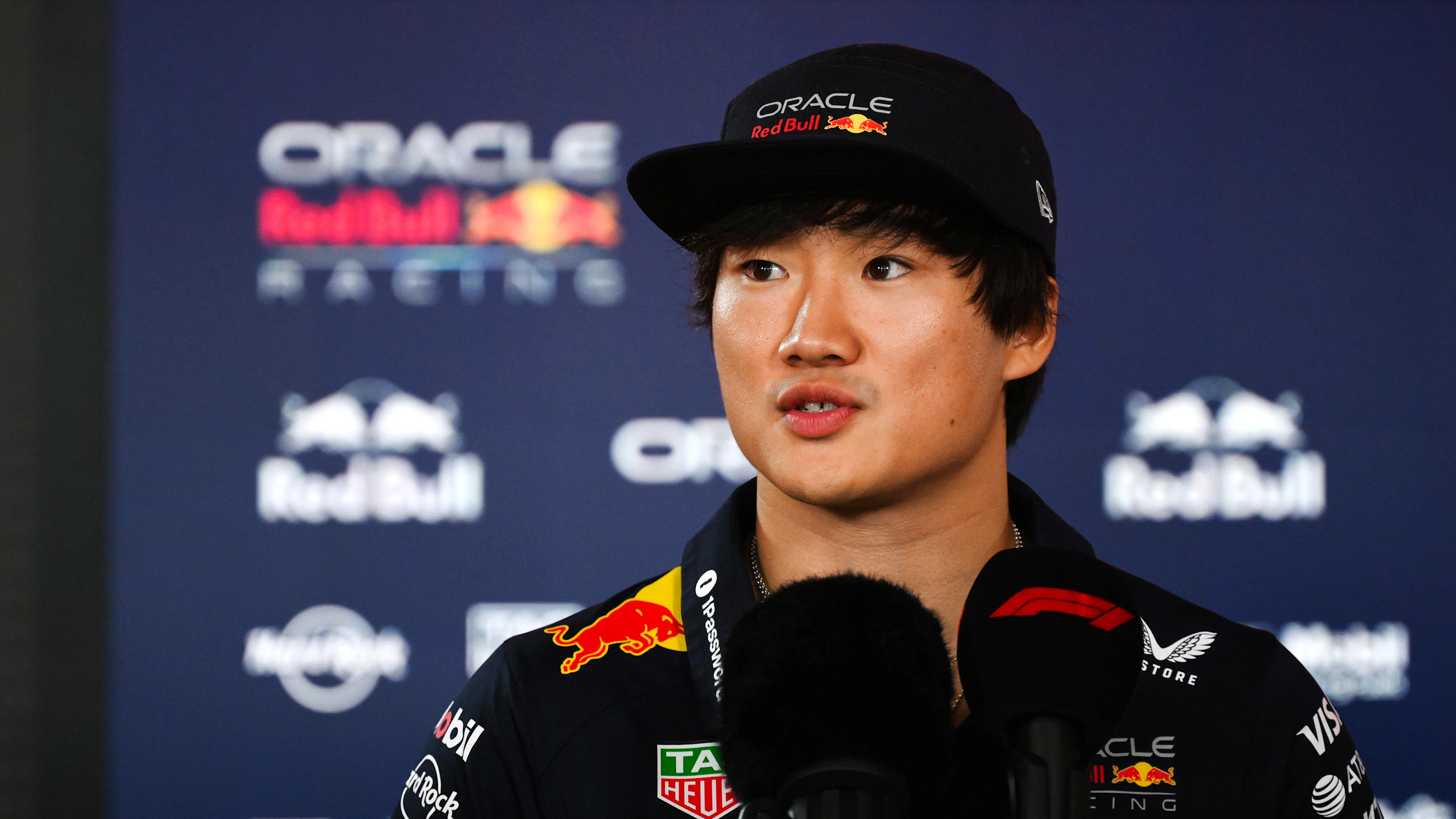 BAKU, AZERBAIJAN - SEPTEMBER 18: Yuki Tsunoda of Japan and Oracle Red Bull Racing talks to the