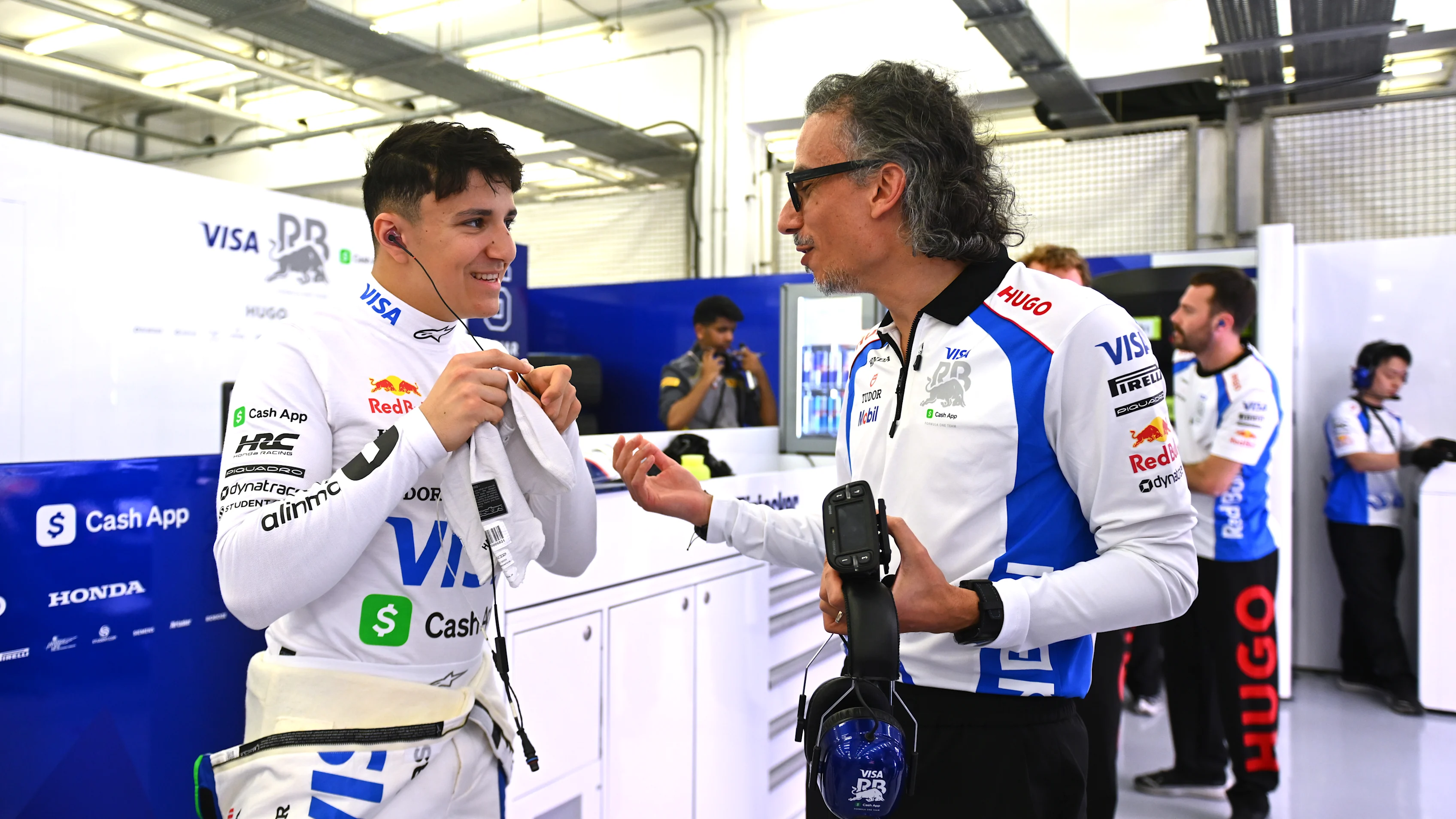 BAHRAIN, BAHRAIN - APRIL 11: Isack Hadjar of France and Visa Cash App Racing Bulls talks with