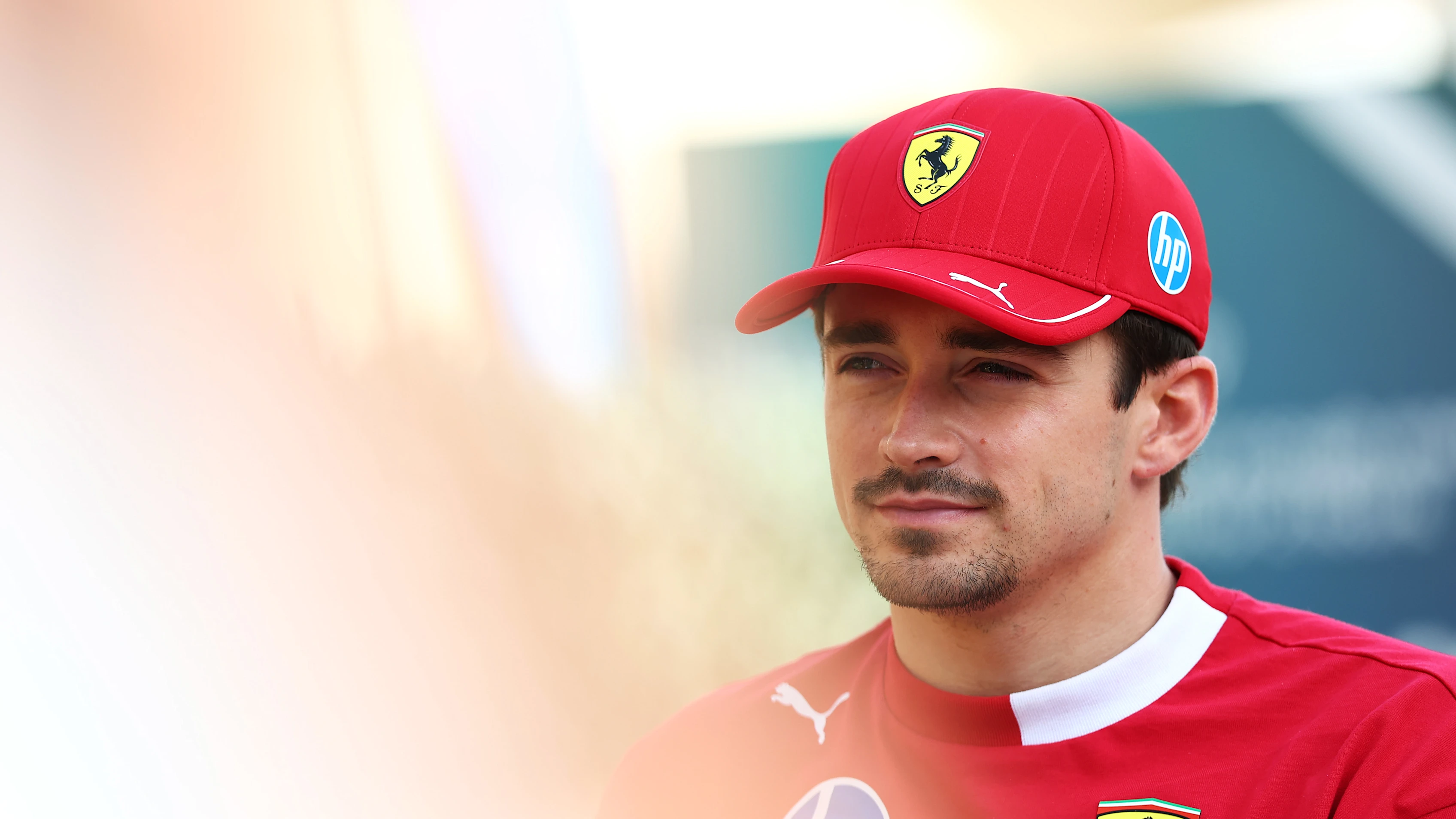 BAHRAIN, BAHRAIN - APRIL 10: Charles Leclerc of Monaco and Scuderia Ferrari looks on in the Paddock