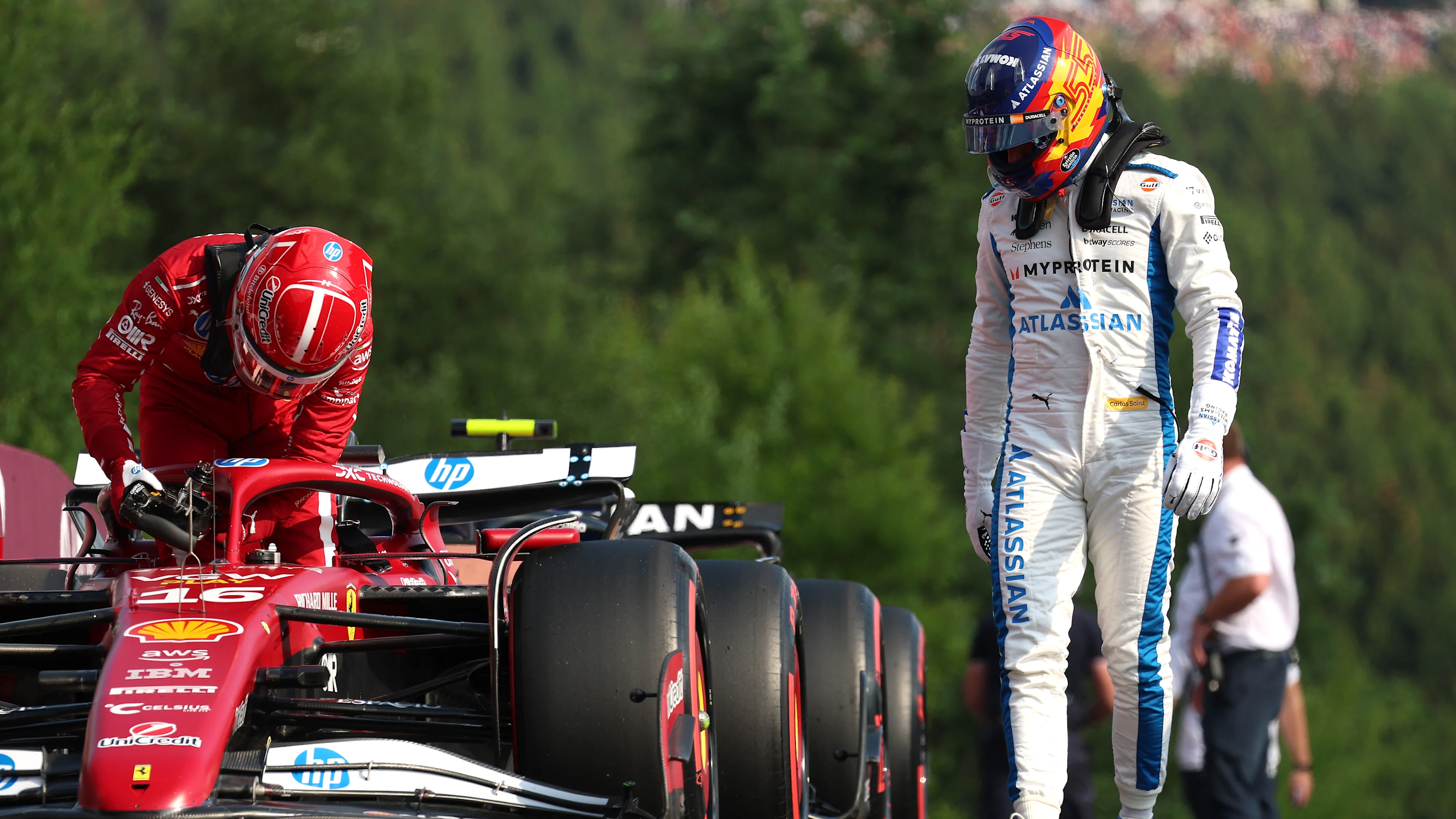 SPA, BELGIUM - JULY 25: Charles Leclerc of Monaco and Scuderia Ferrari and Carlos Sainz of Spain and Williams in parc ferme during Sprint qualifying ahead of the F1 Grand Prix of Belgium at Circuit de Spa-Francorchamps on July 25, 2025 in Spa, Belgium. (Photo by Mark Thompson/Getty Images)