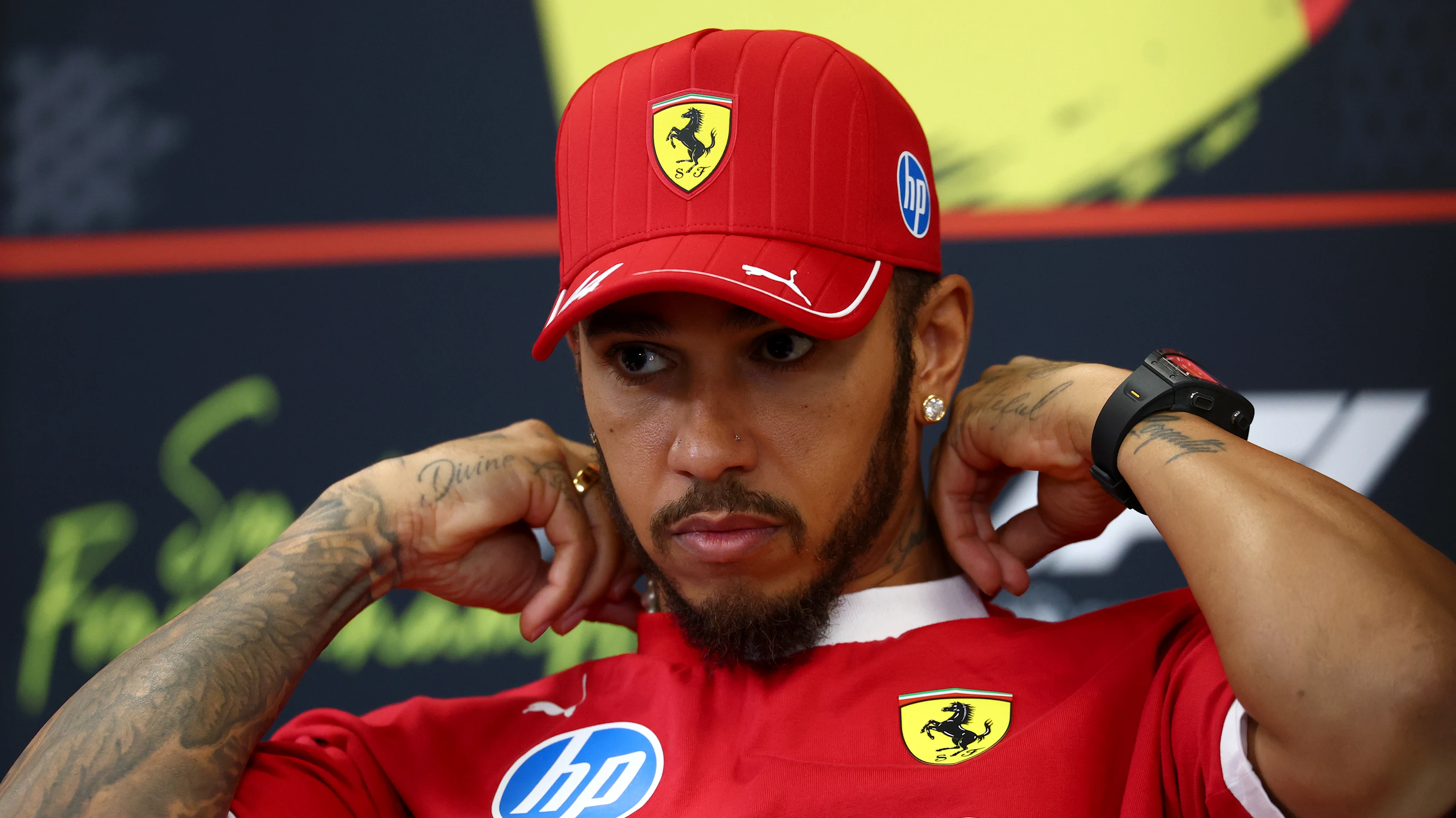 SPA, BELGIUM - JULY 24: Lewis Hamilton of Great Britain and Scuderia Ferrari speaks in the Drivers