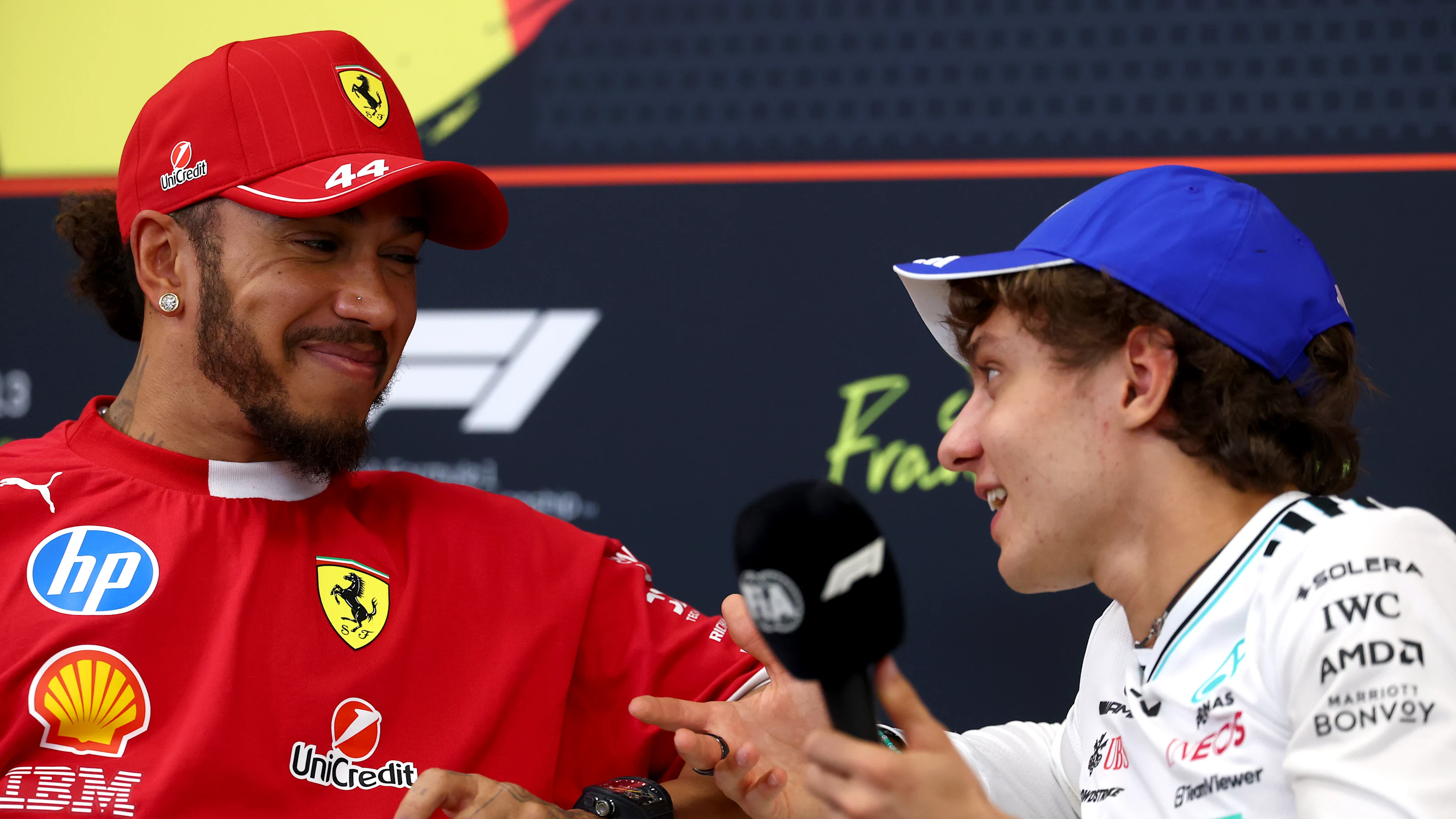 SPA, BELGIUM - JULY 24: Lewis Hamilton of Great Britain and Scuderia Ferrari talks with Andrea Kimi