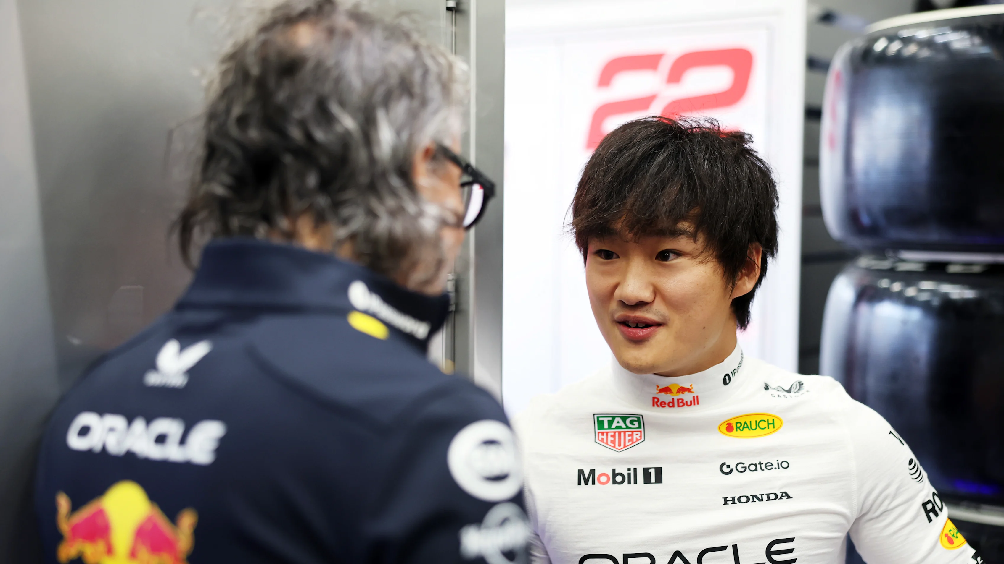 SPA, BELGIUM - JULY 26: Yuki Tsunoda of Japan and Oracle Red Bull Racing talks with Laurent Mekies,