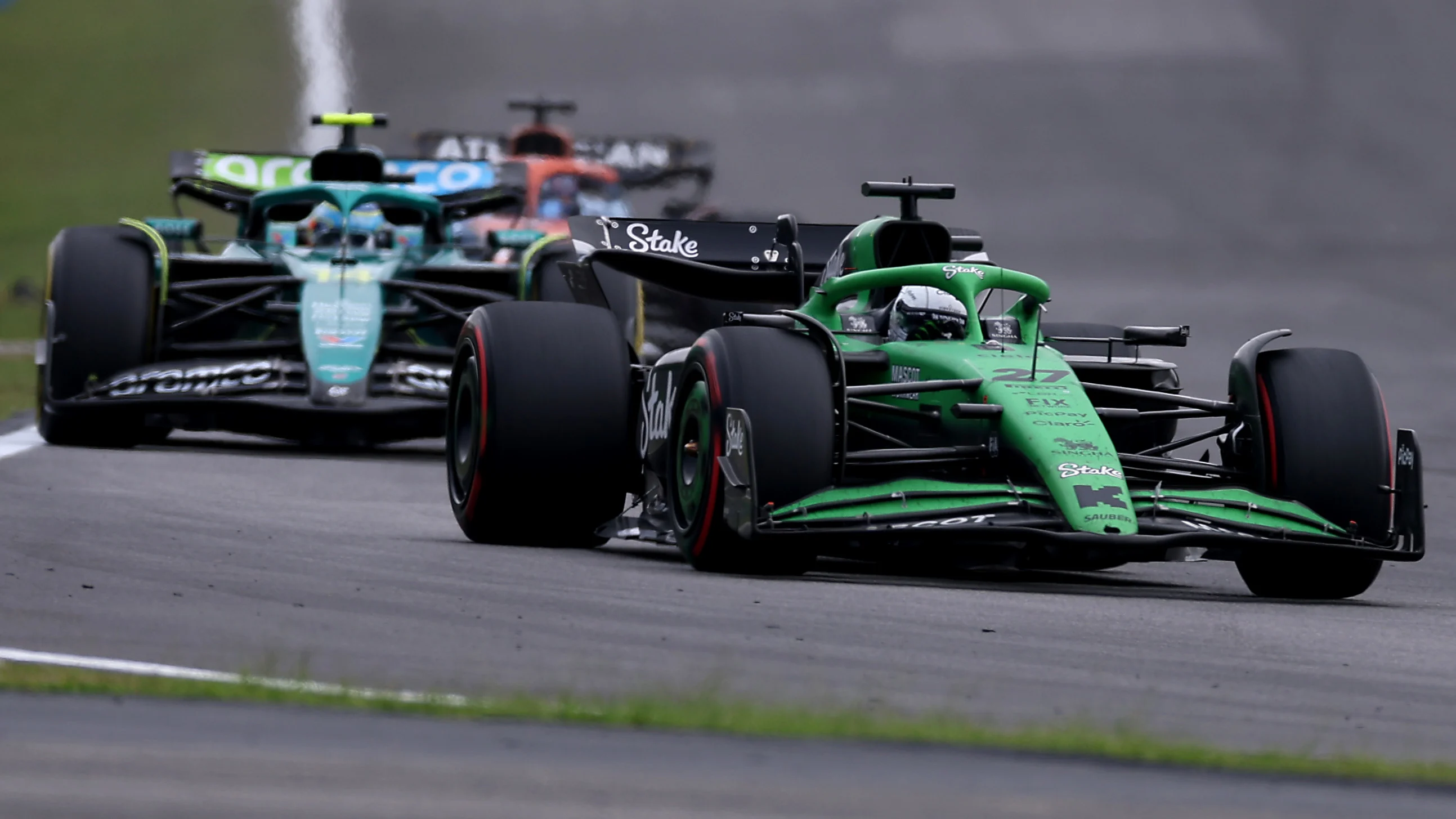SAO PAULO, BRAZIL - NOVEMBER 09: Nico Hulkenberg of Germany driving the (27) Kick Sauber C45 Ferrari leads Fernando Alonso of Spain driving the (14) Aston Martin F1 Team AMR25 Mercedes on track during the F1 Grand Prix of Brazil at Autodromo Jose Carlos Pace on November 09, 2025 in Sao Paulo, Brazil. (Photo by Lars Baron/Getty Images)