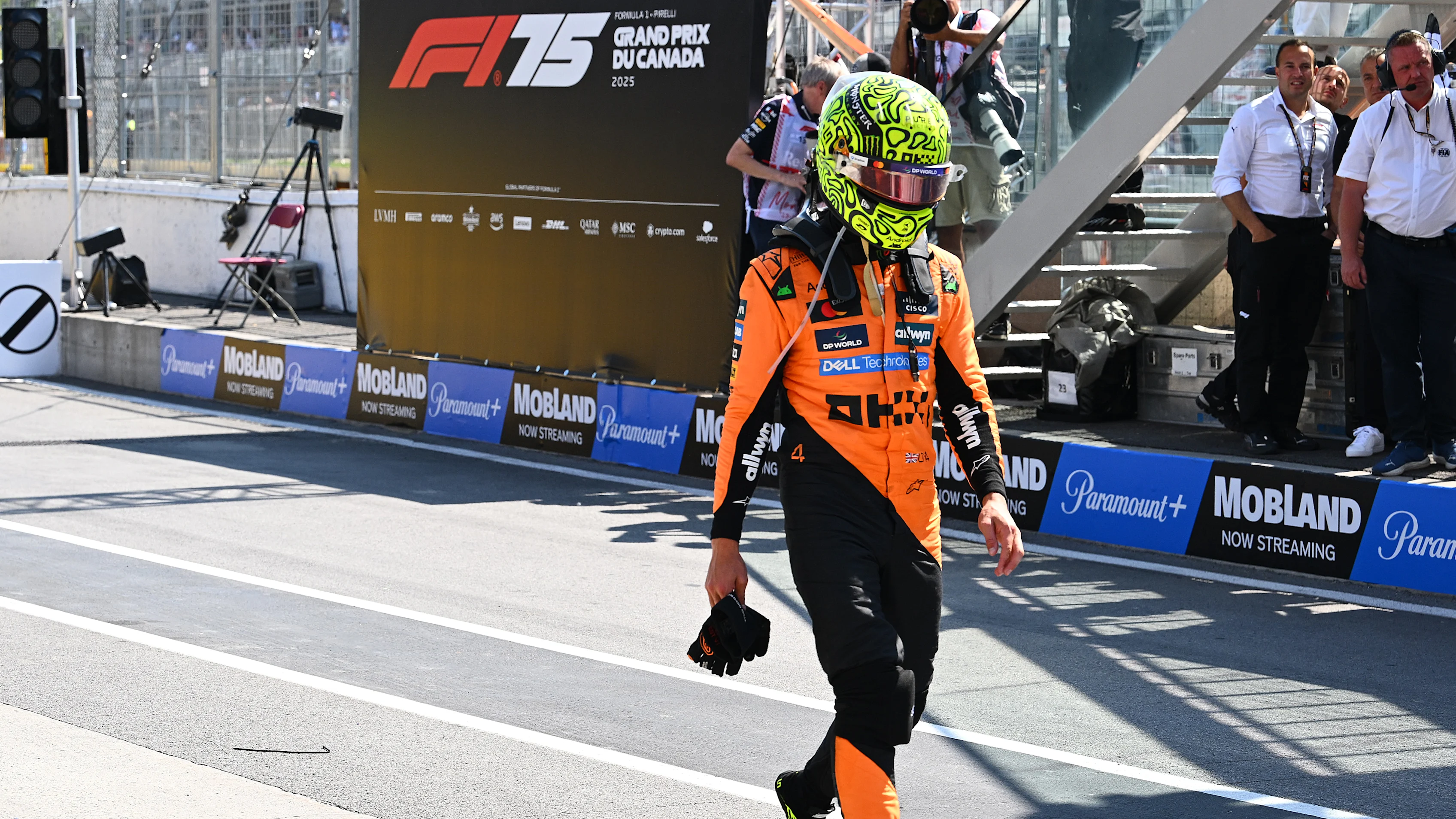 MONTREAL, QUEBEC - JUNE 15: Lando Norris of Great Britain and McLaren walks down the pit lane after