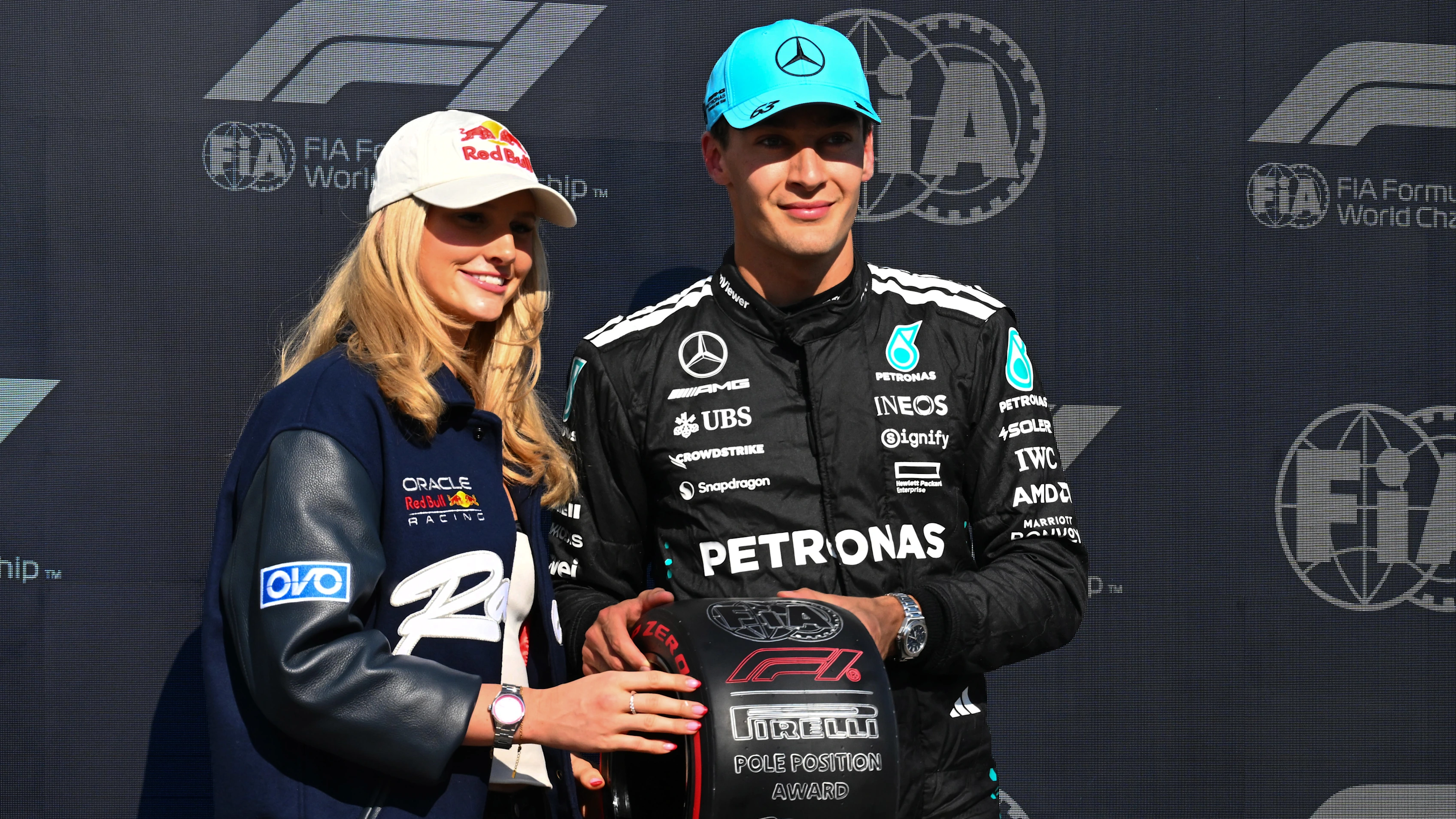 MONTREAL, QUEBEC - JUNE 14: Summer McIntosh presents Pole position qualifier George Russell of