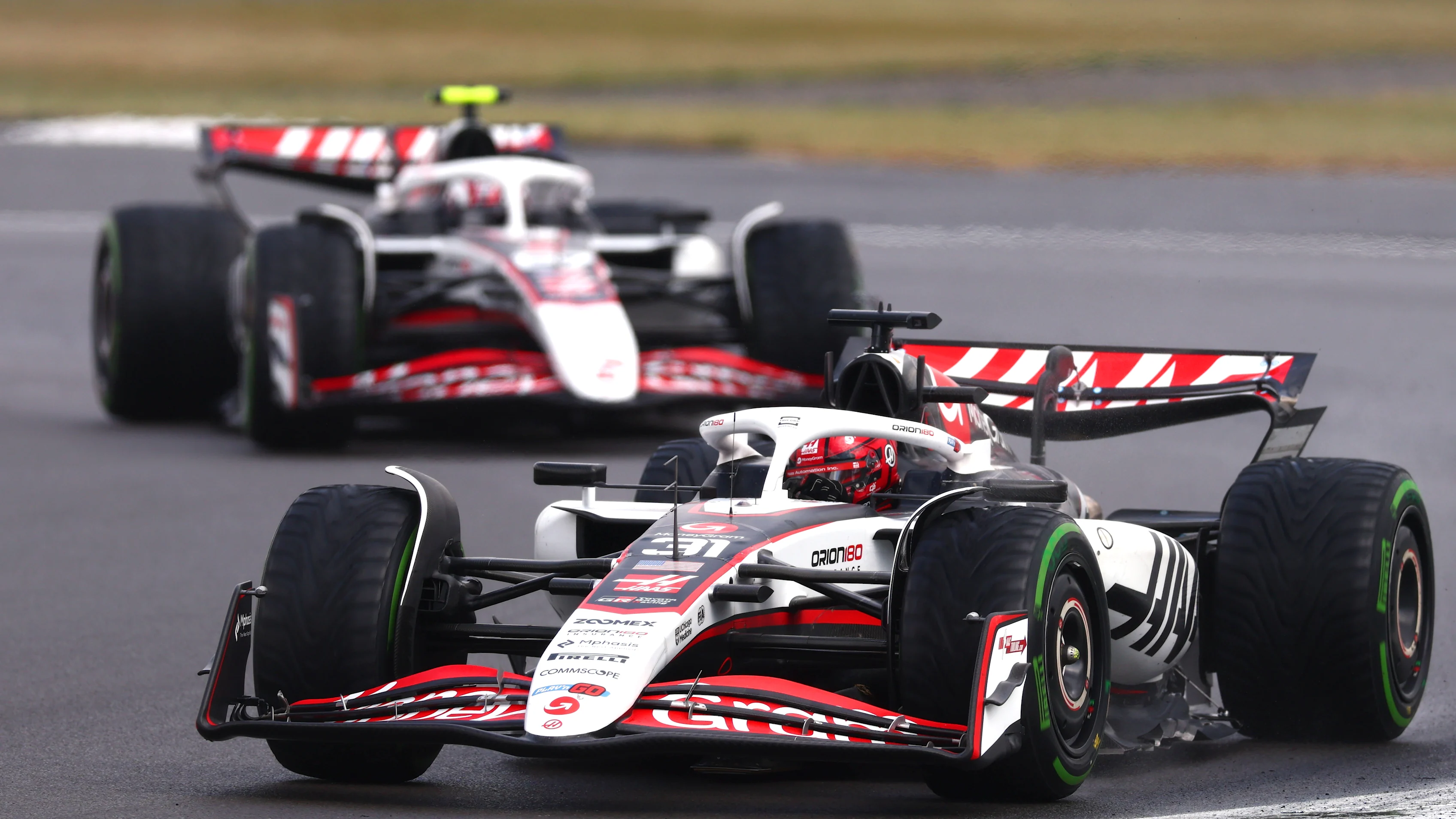 NORTHAMPTON, ENGLAND - JULY 06: Esteban Ocon of France driving the (31) Haas F1 VF-25 Ferrari leads