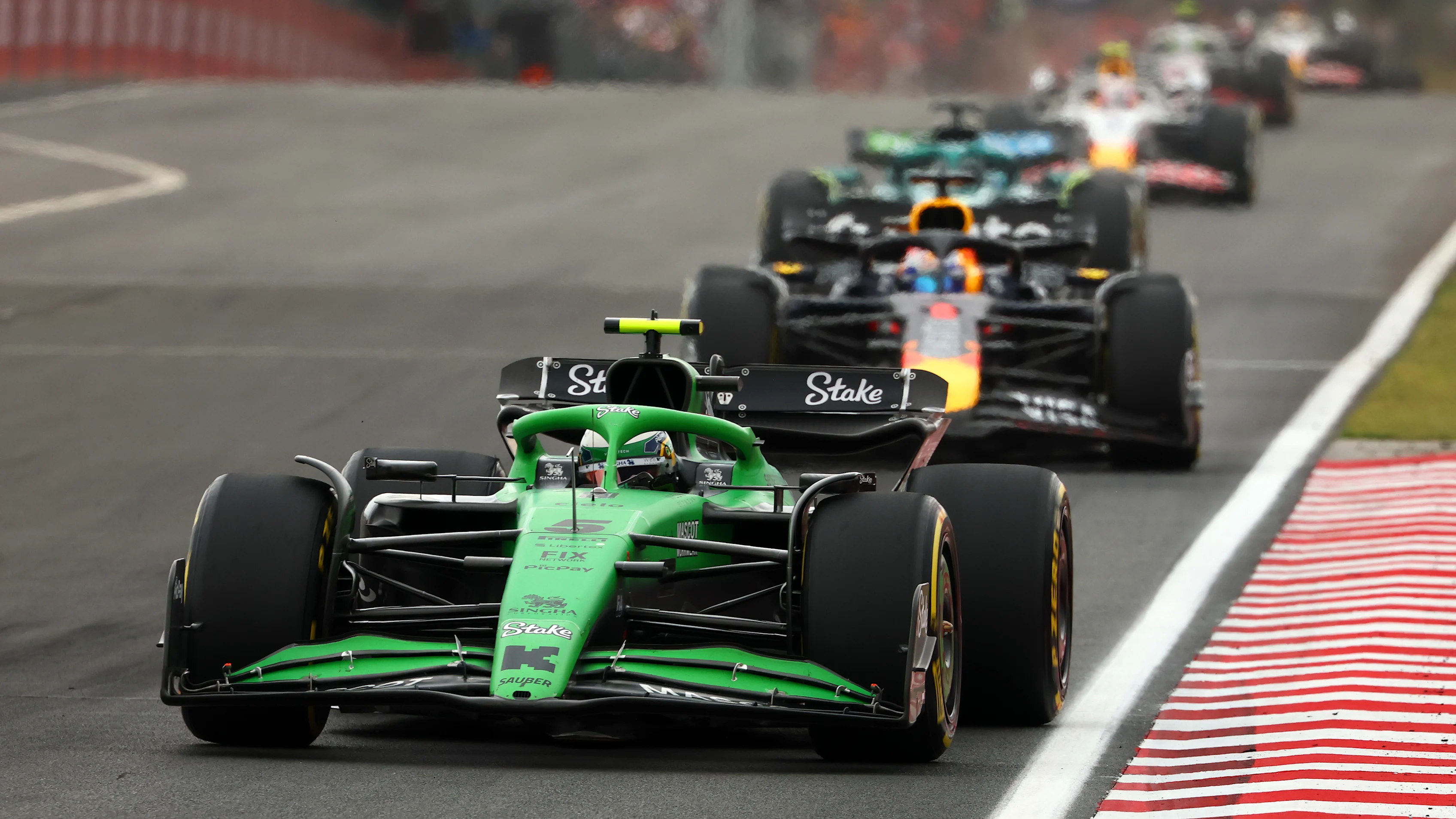 BUDAPEST, HUNGARY - AUGUST 03: Gabriel Bortoleto of Brazil driving the (5) Kick Sauber C45 Ferrari leads Max Verstappen of the Netherlands driving the (1) Oracle Red Bull Racing RB21 on track during the F1 Grand Prix of Hungary at Hungaroring on August 03, 2025 in Budapest, Hungary. (Photo by Clive Rose/Getty Images)