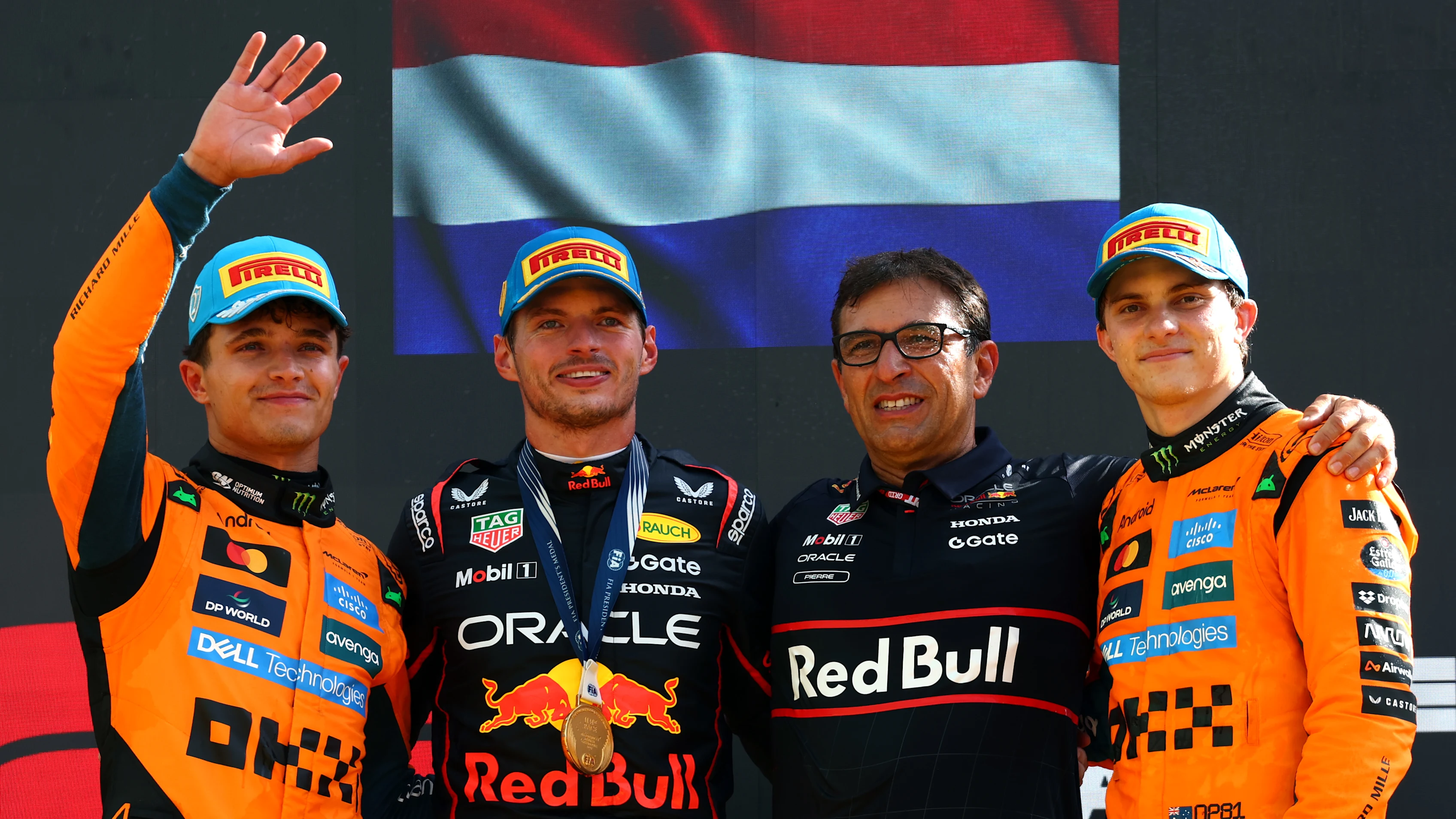MONZA, ITALY - SEPTEMBER 07: Race winner Max Verstappen of the Netherlands and Oracle Red Bull Racing Second placed Lando Norris of Great Britain and McLaren Third placed Oscar Piastri of Australia and McLaren and Pierre Wache, Technical Director of Oracle Red Bull Racing on the podium during the F1 Grand Prix of Italy at Autodromo Nazionale Monza on September 07, 2025 in Monza, Italy. (Photo by Clive Rose/Getty Images)