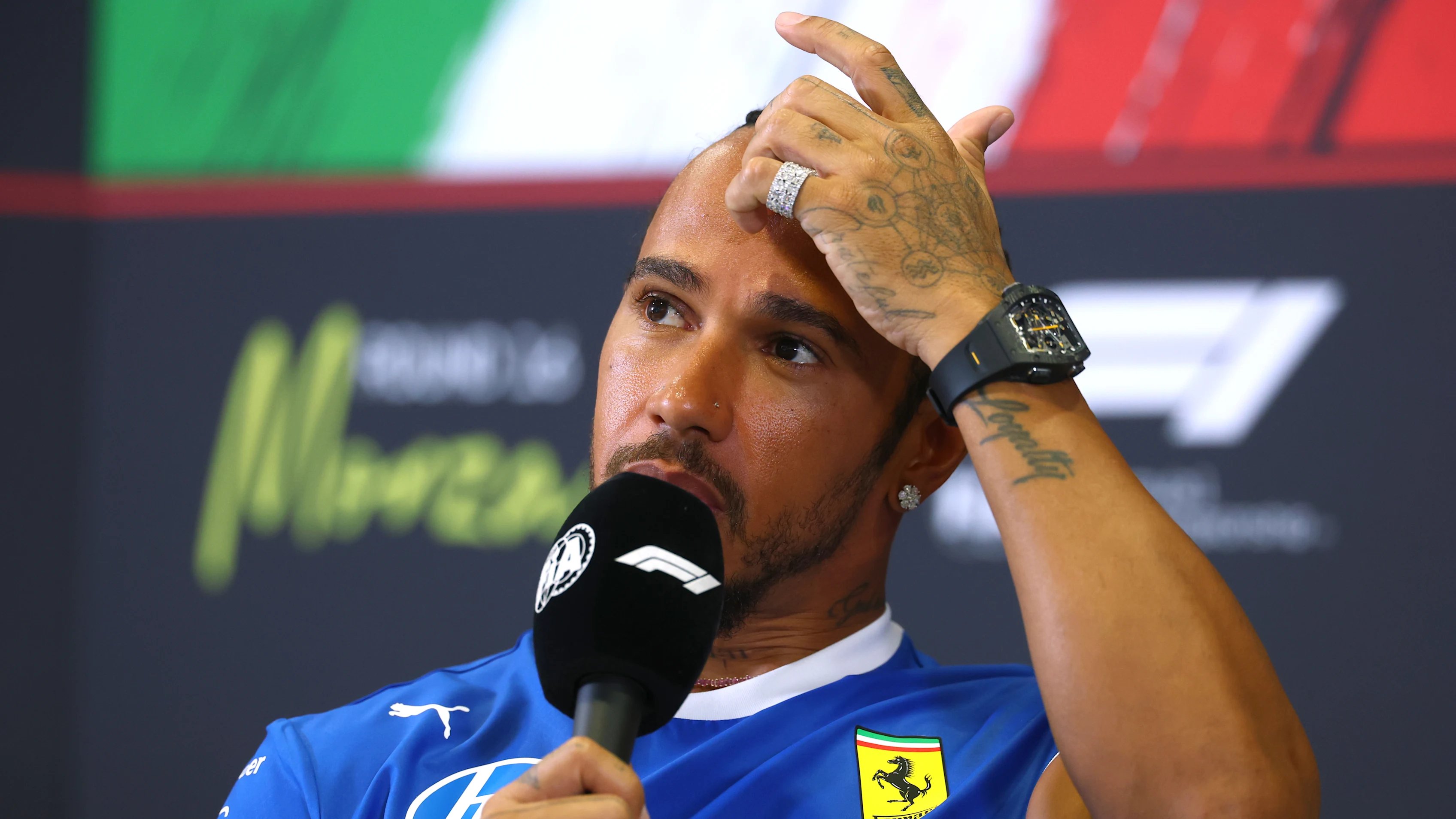 MONZA, ITALY - SEPTEMBER 04: Lewis Hamilton of Great Britain and Scuderia Ferrari speaks in the