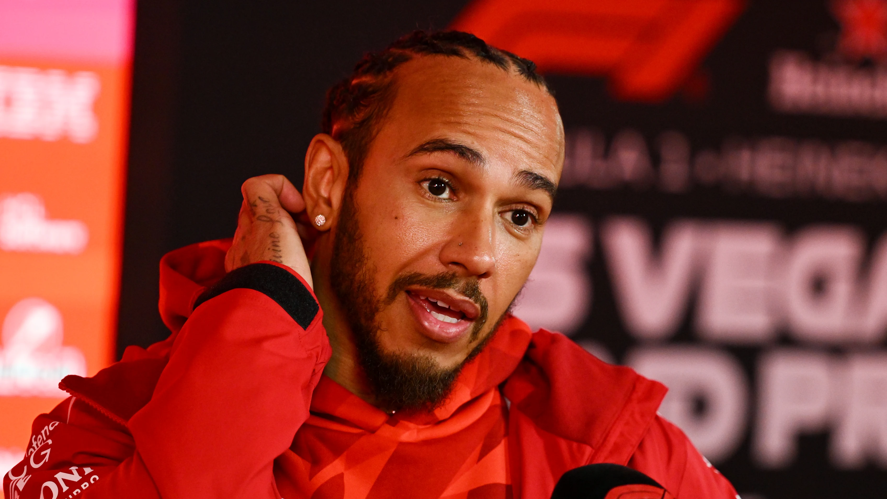 LAS VEGAS, NEVADA - NOVEMBER 19: Lewis Hamilton of Great Britain and Scuderia Ferrari talks to the