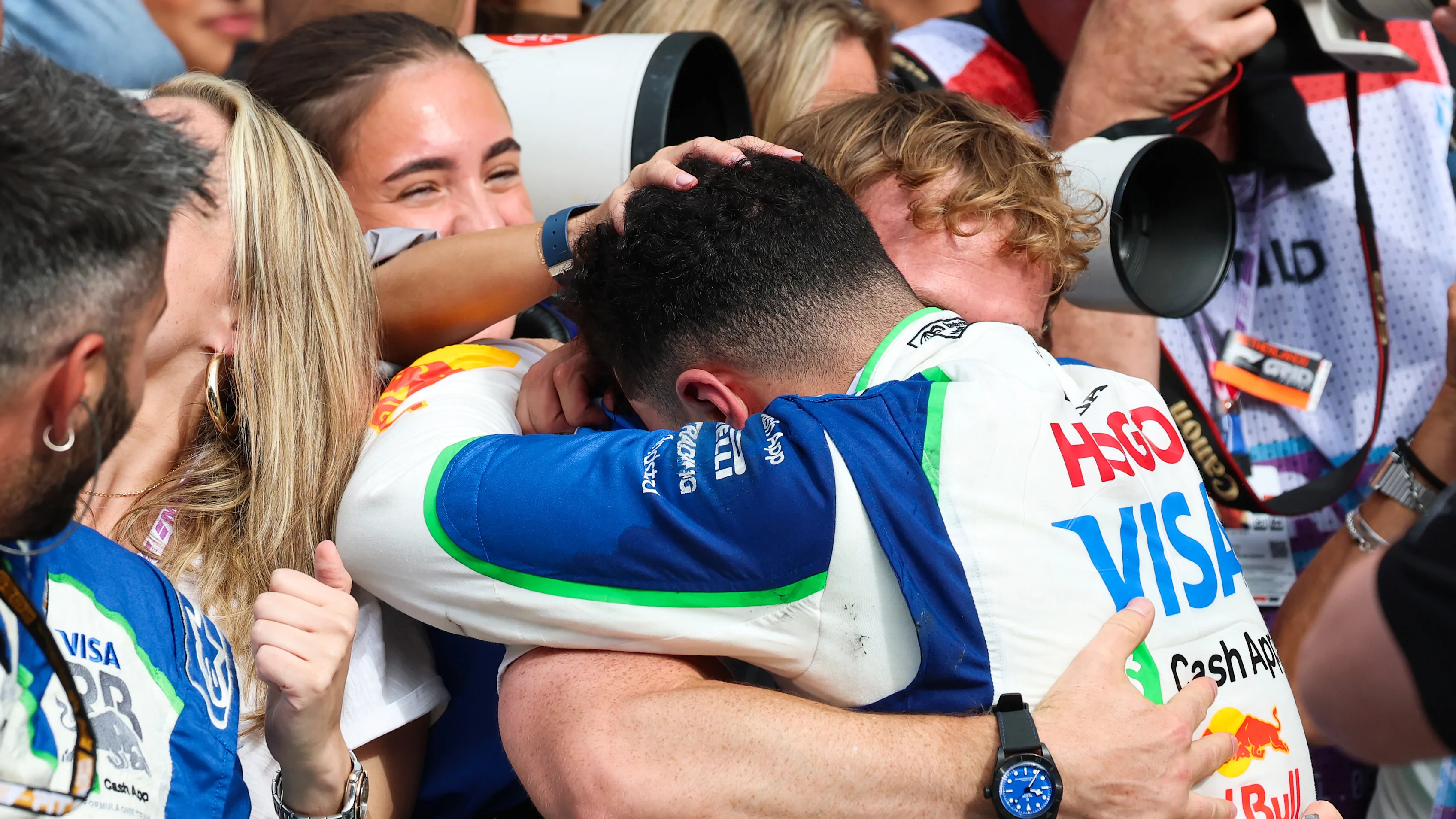 ZANDVOORT, NETHERLANDS - AUGUST 31: Third placed Isack Hadjar of France and Visa Cash App Racing Bulls celebrates with his team in parc ferme during the F1 Grand Prix of Netherlands at Circuit Zandvoort on August 31, 2025 in Zandvoort, Netherlands. (Photo by Mark Thompson/Getty Images)