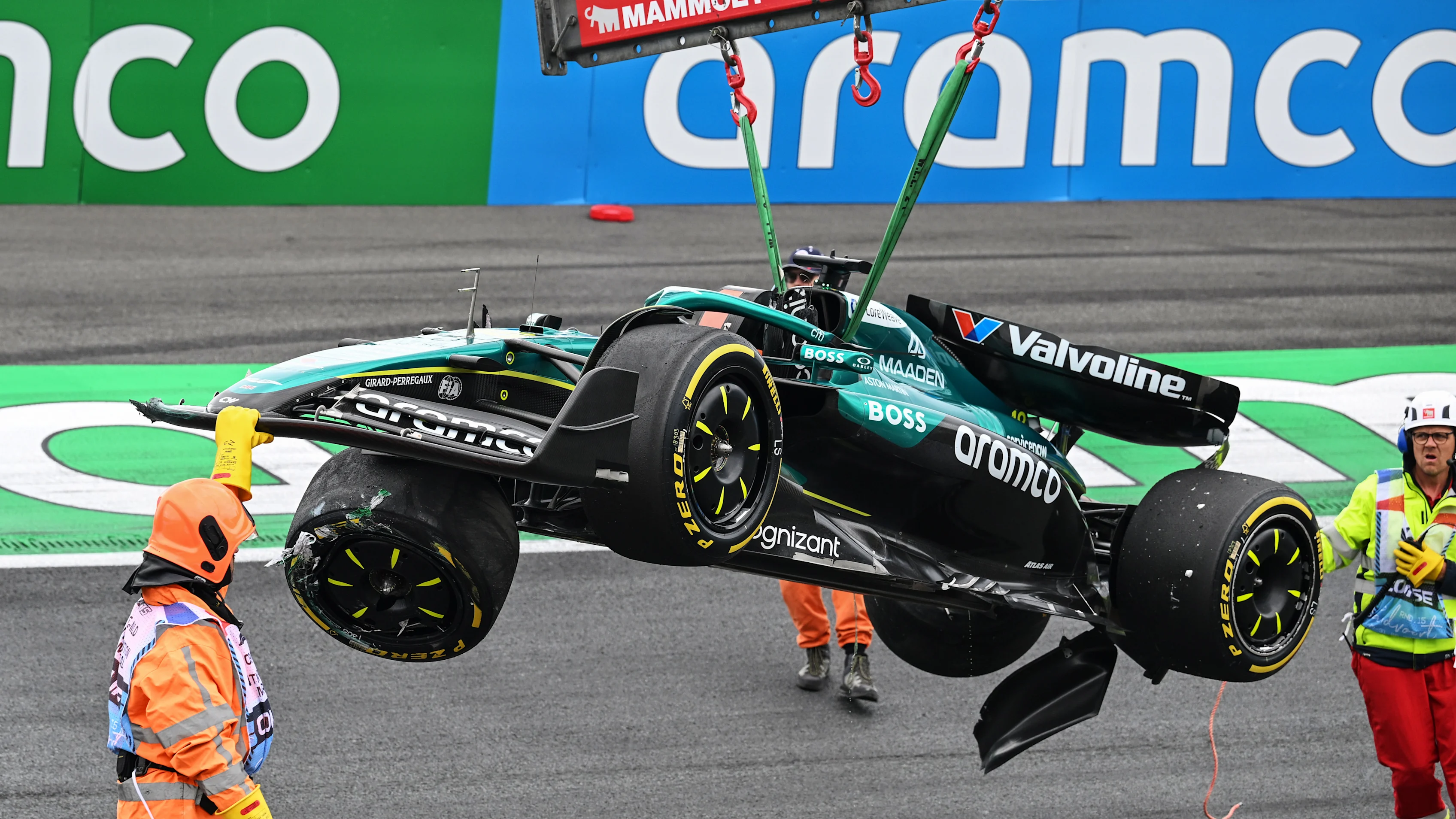 ZANDVOORT, NETHERLANDS - AUGUST 29: Marshals recover the damaged car of Lance Stroll of Canada and