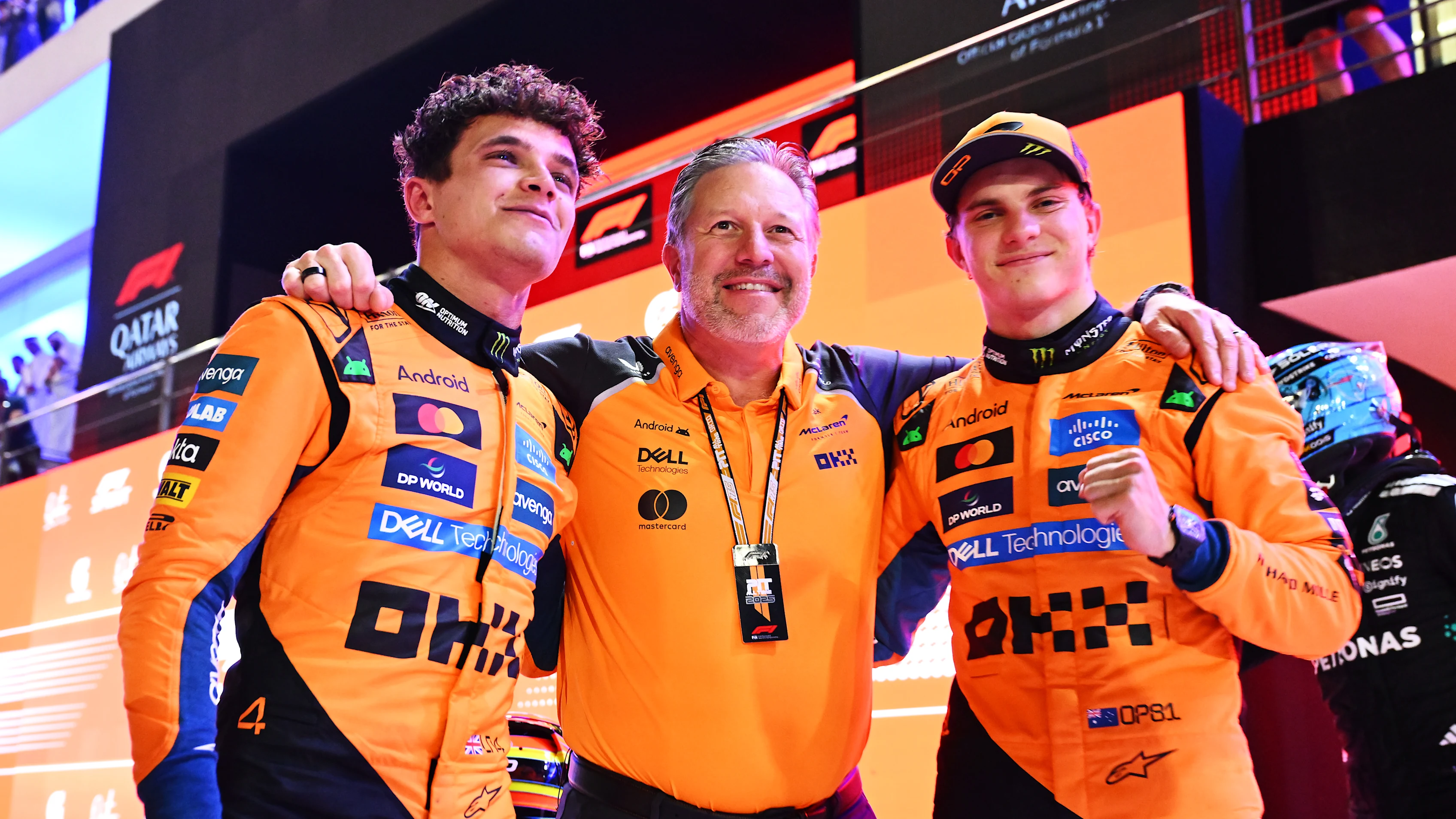 LUSAIL CITY, QATAR - NOVEMBER 29: Zak Brown, Chief Executive Officer of McLaren celebrates with Sprint winner Oscar Piastri of Australia and McLaren and Third placed Lando Norris of Great Britain and McLaren in parc ferme during the Sprint ahead of the F1 Grand Prix of Qatar at Lusail International Circuit on November 29, 2025 in Lusail City, Qatar. (Photo by Mark Sutton - Formula 1/Formula 1 via Getty Images)