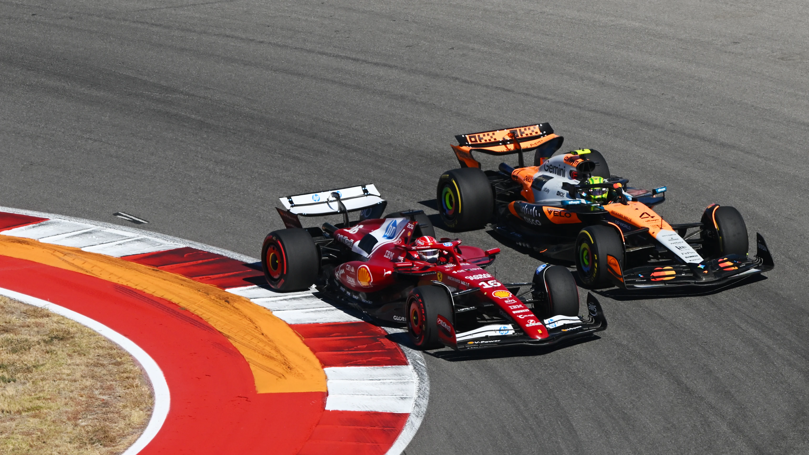 AUSTIN, TEXAS - OCTOBER 19: Charles Leclerc of Monaco driving the (16) Scuderia Ferrari SF-25 leads Lando Norris of Great Britain driving the (4) McLaren MCL39 Mercedes on track during the F1 Grand Prix of United States at Circuit of The Americas on October 19, 2025 in Austin, Texas. (Photo by Clive Mason/Getty Images)