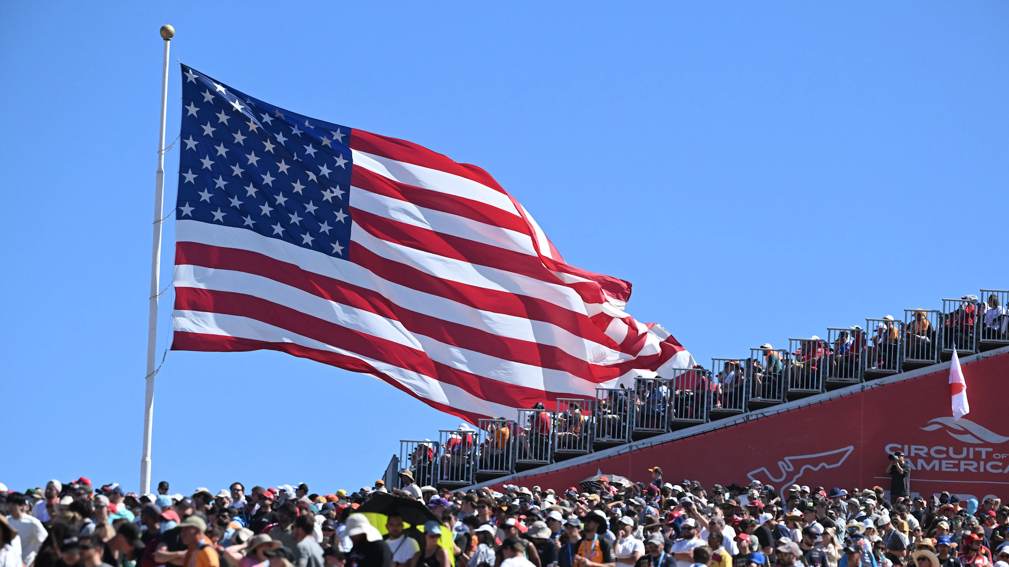 AUSTIN, TEXAS - OCTOBER 19: A huge crowd and huge US flag during the F1 Grand Prix of United States