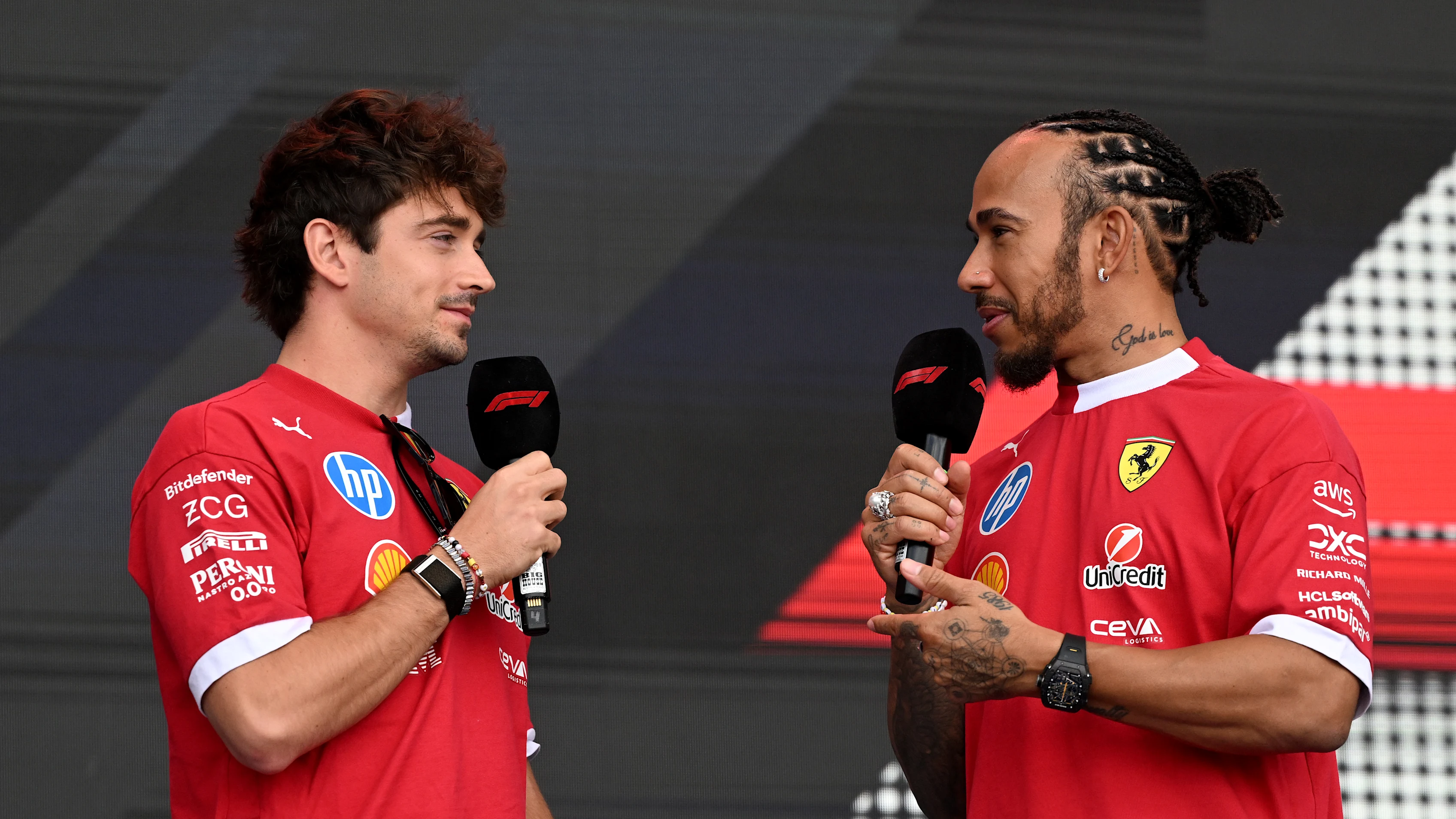 AUSTIN, TEXAS - OCTOBER 17: Charles Leclerc of Monaco and Scuderia Ferrari and Lewis Hamilton of