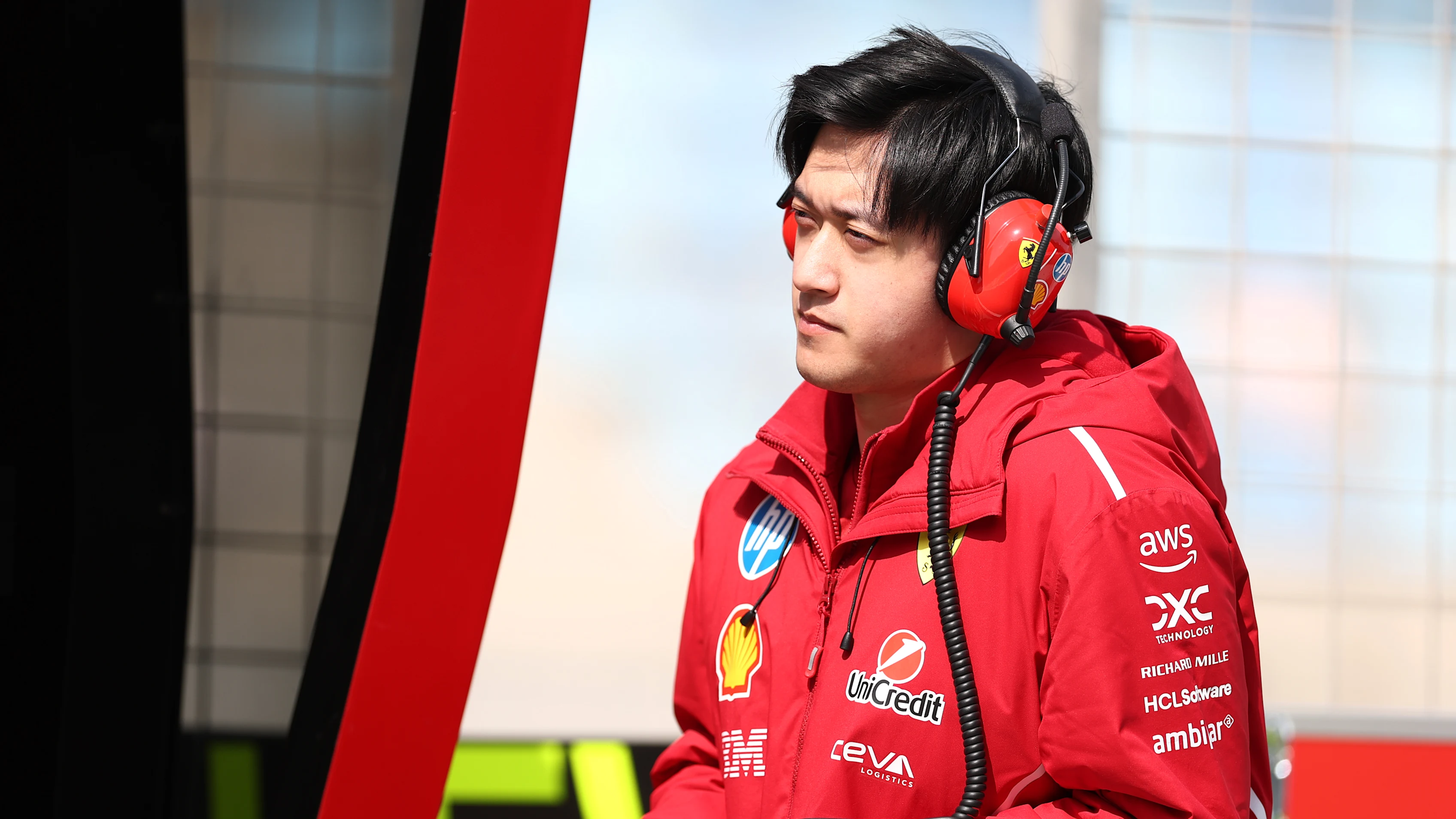 BAHRAIN, BAHRAIN - FEBRUARY 26: Zhou Guanyu of China and Scuderia Ferrari looks on from the pit