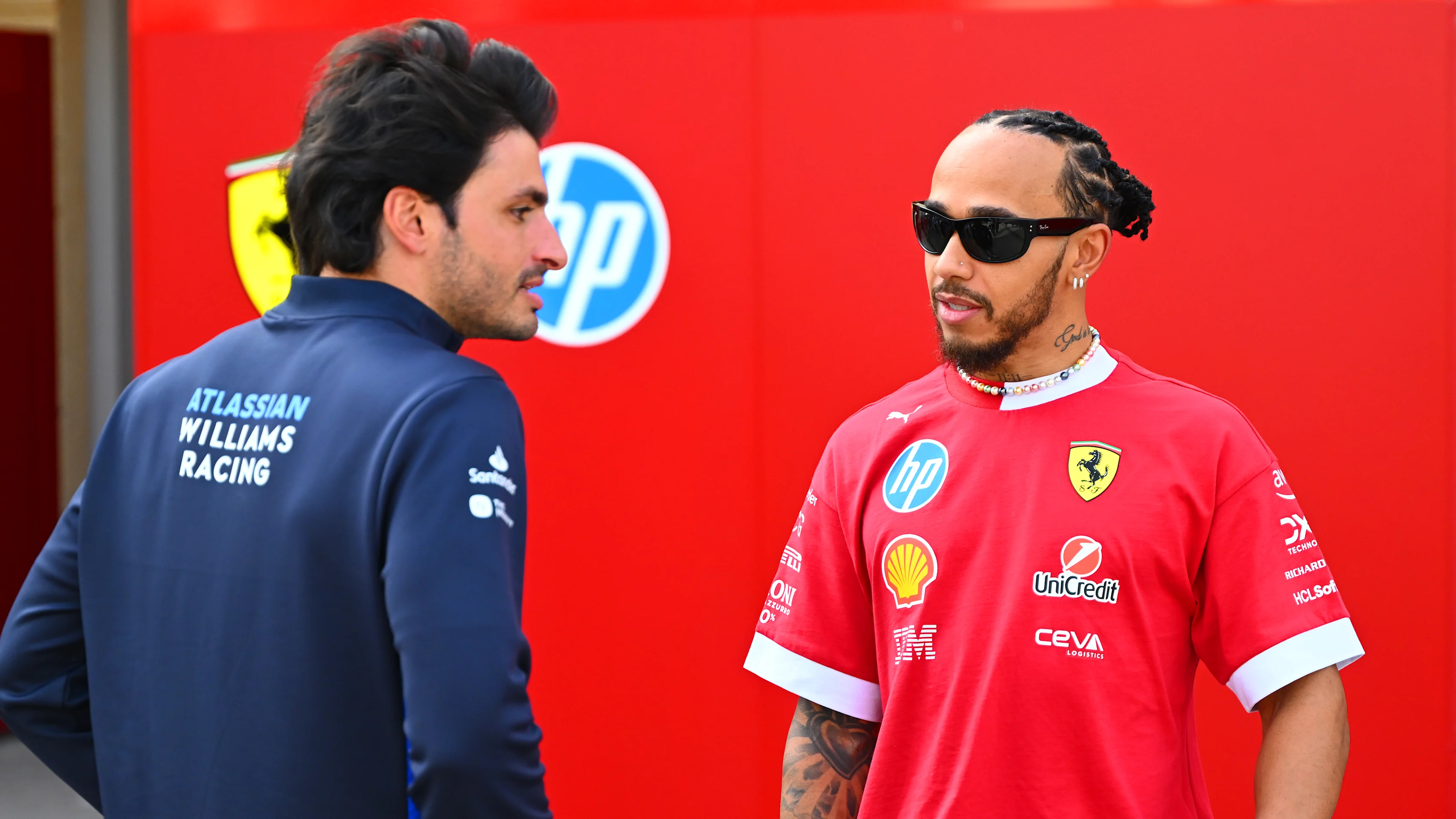 BAHRAIN, BAHRAIN - FEBRUARY 28: Lewis Hamilton of Great Britain and Scuderia Ferrari talks with