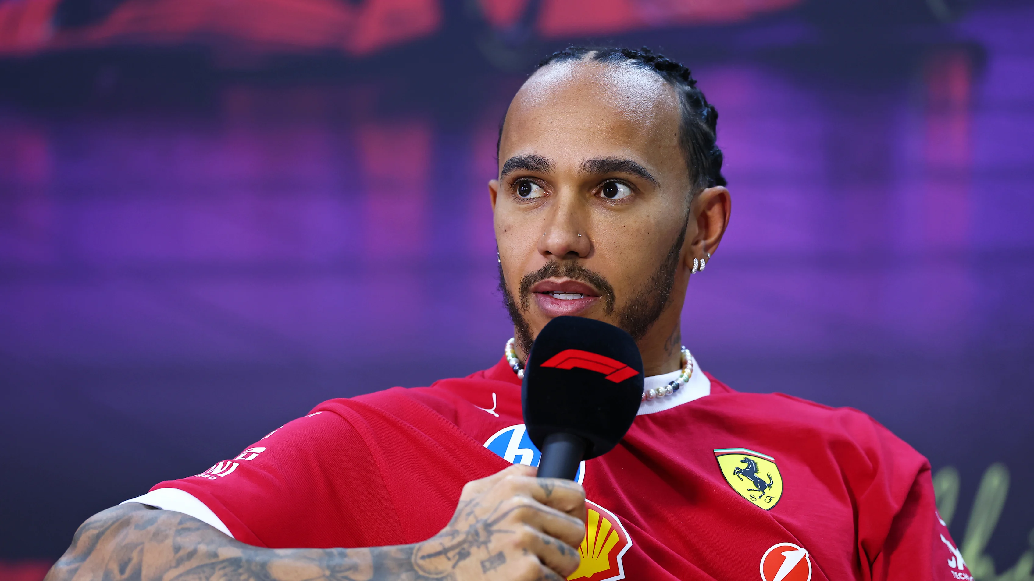 BAHRAIN, BAHRAIN - FEBRUARY 28: Lewis Hamilton of Great Britain and Scuderia Ferrari speaks during