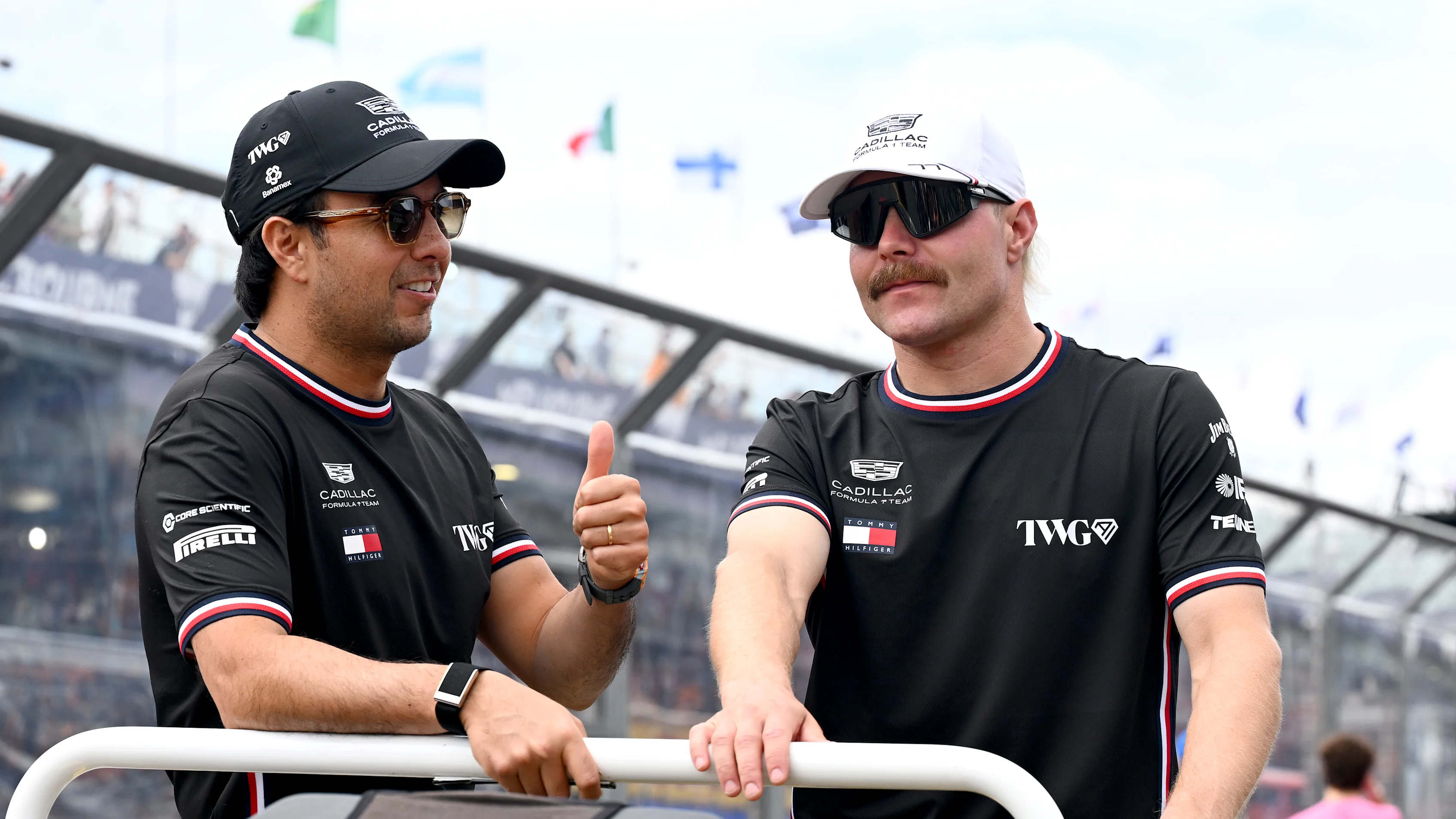 MELBOURNE, AUSTRALIA - MARCH 08: Sergio Perez of Mexico and Cadillac F1 Team and Valtteri Bottas of