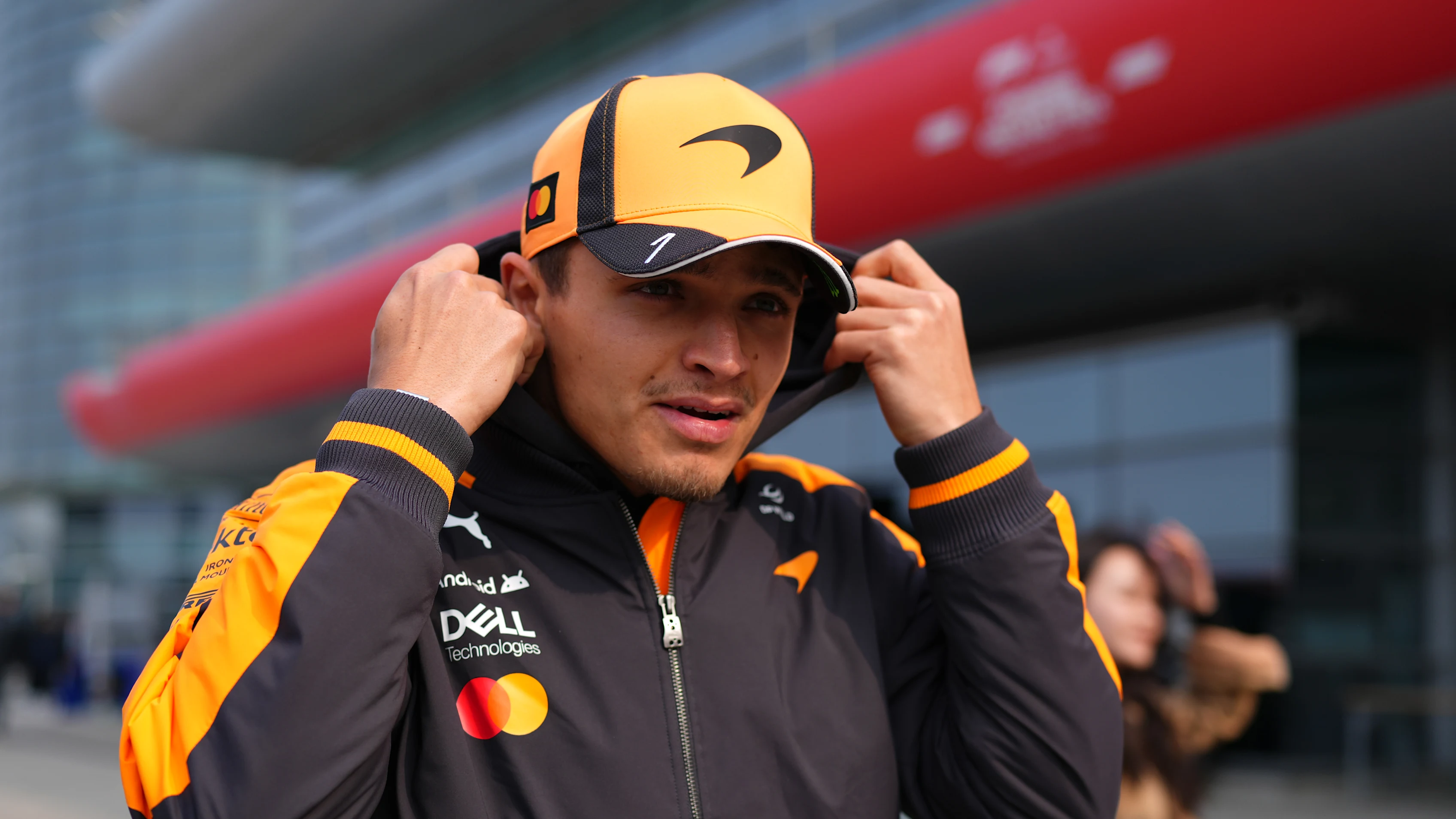SHANGHAI, CHINA - MARCH 12: Lando Norris of Great Britain and McLaren walks in the Paddock during