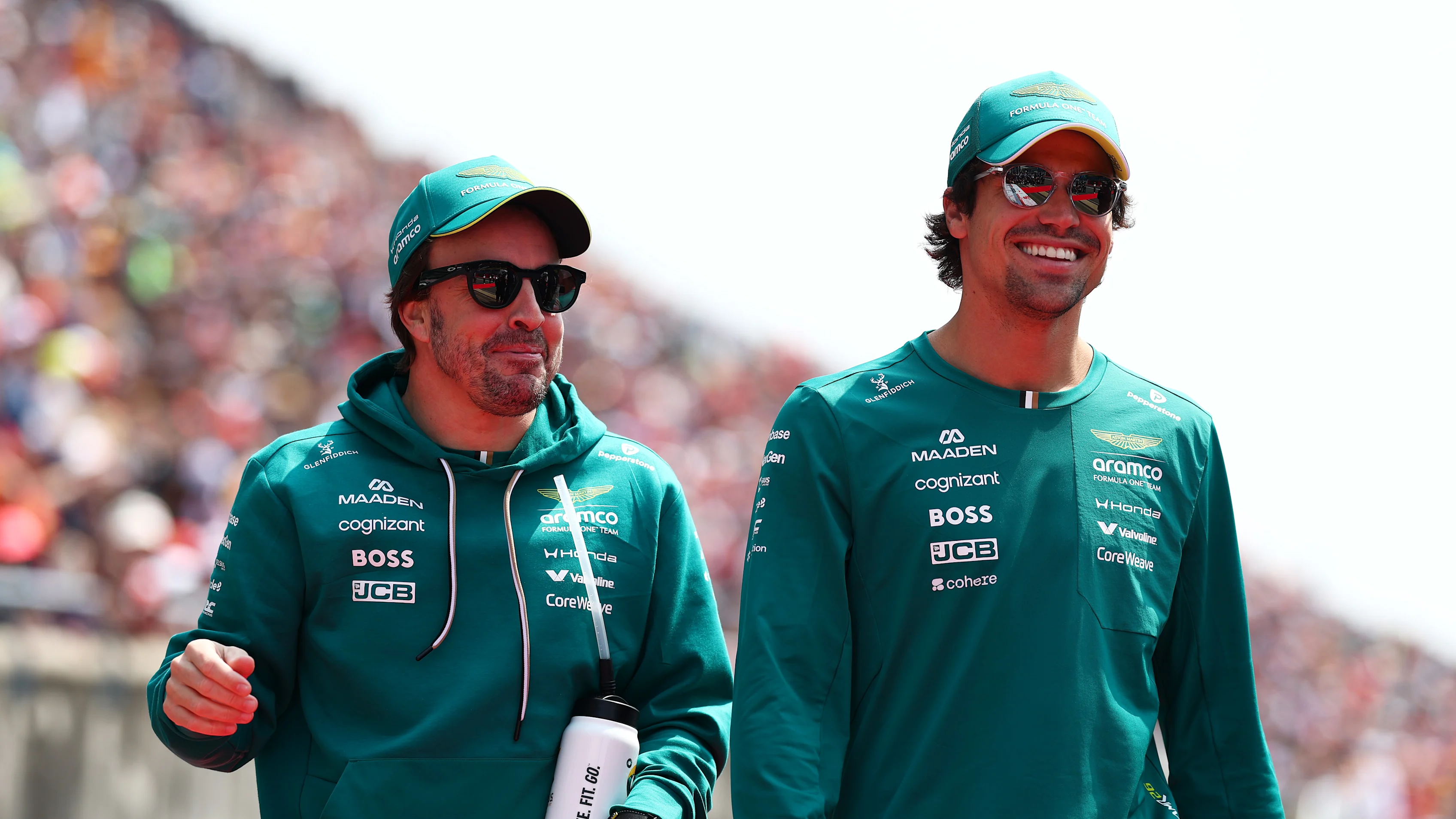SUZUKA, JAPAN - MARCH 29: Fernando Alonso of Spain and Aston Martin F1 Team and Lance Stroll of