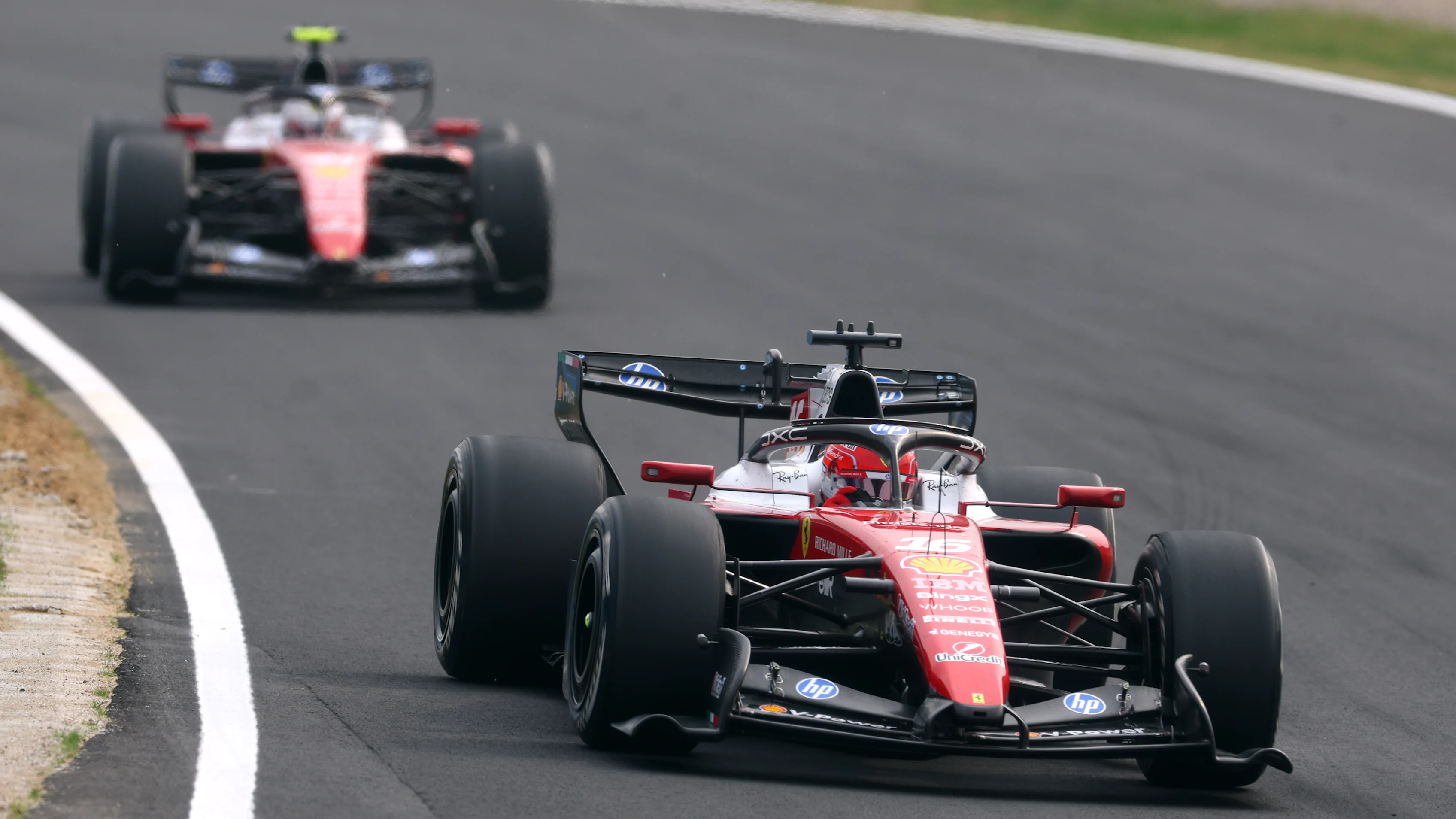 SUZUKA, JAPAN - MARCH 29: Charles Leclerc of Monaco driving the (16) Scuderia Ferrari SF-26 leads