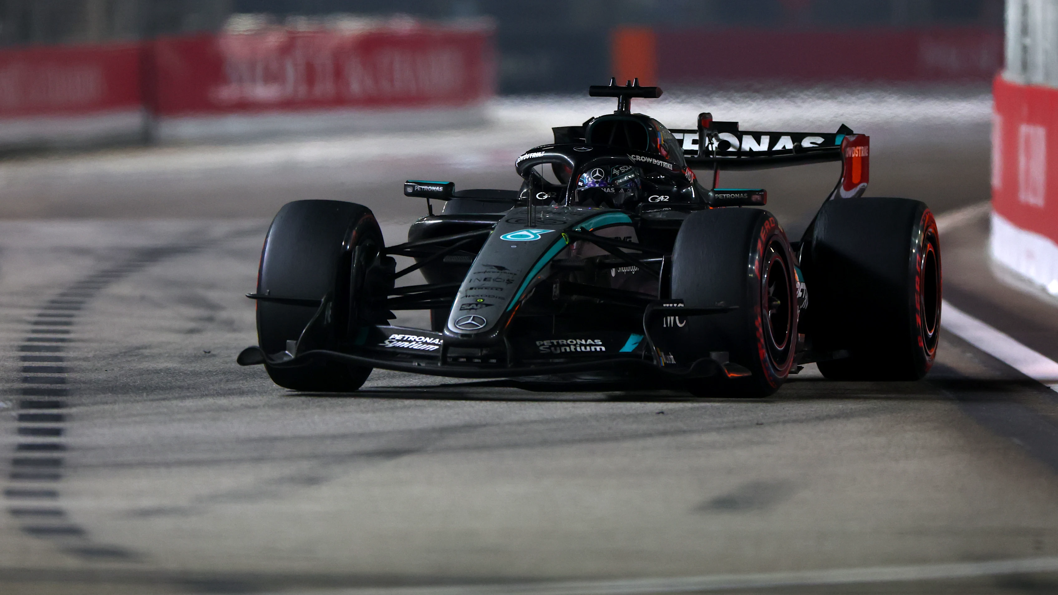 SINGAPORE, SINGAPORE - OCTOBER 11: George Russell of Great Britain driving the (63) Mercedes AMG