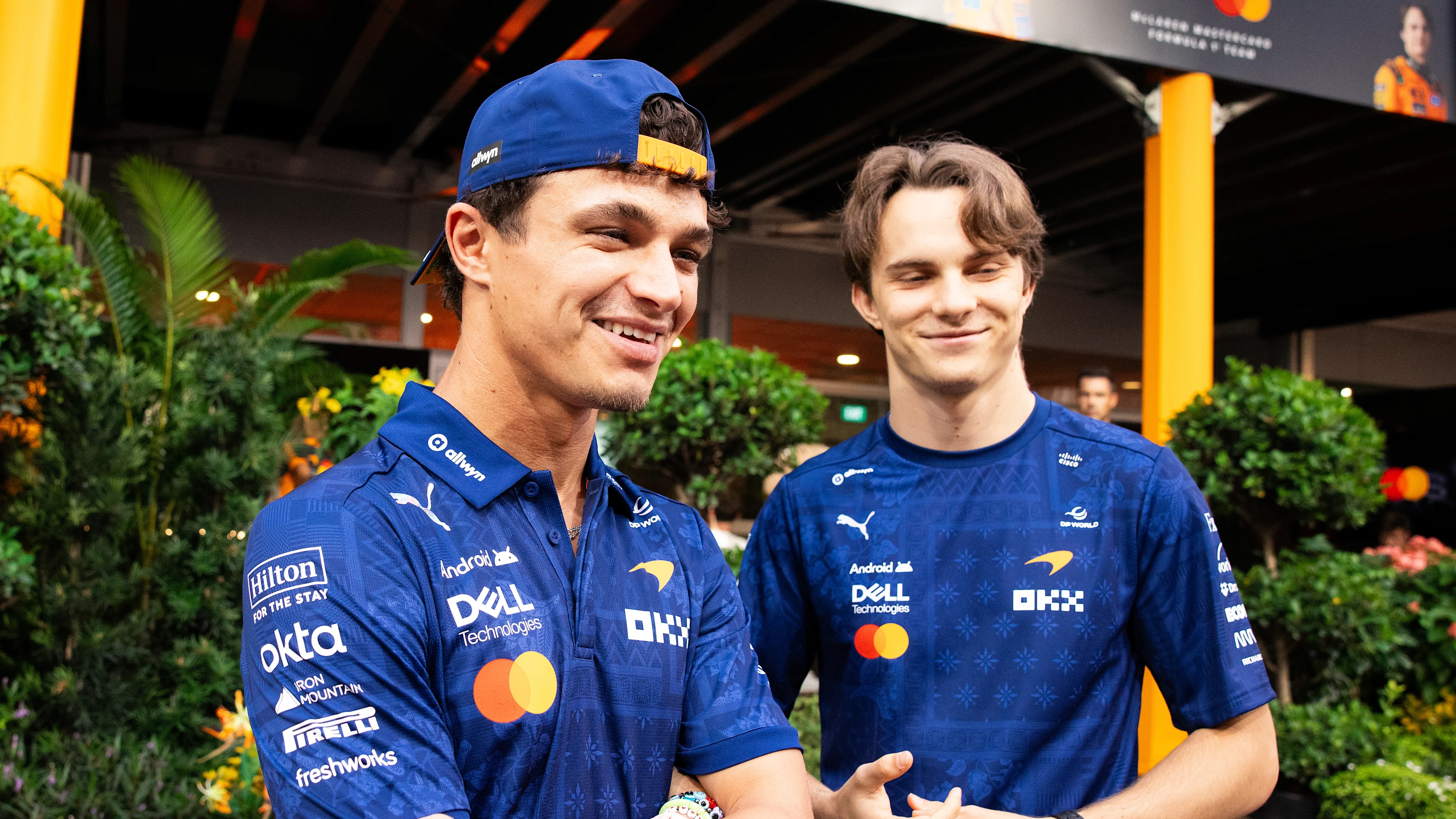 SINGAPORE, SINGAPORE - OCTOBER 08: Lando Norris of Great Britain and McLaren and Oscar Piastri of
