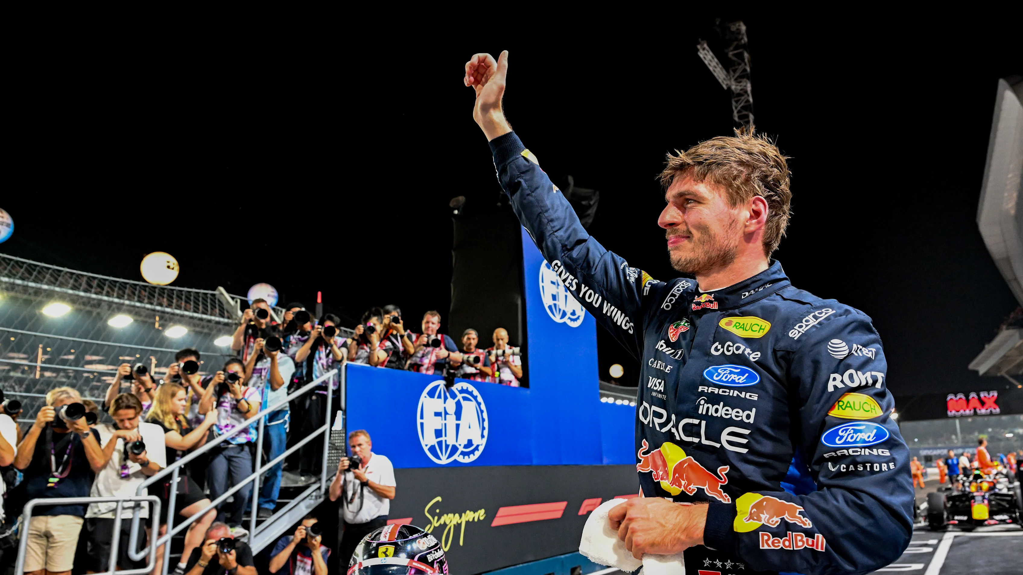 SINGAPORE, SINGAPORE - OCTOBER 10: Pole position qualifier Max Verstappen of the Netherlands and