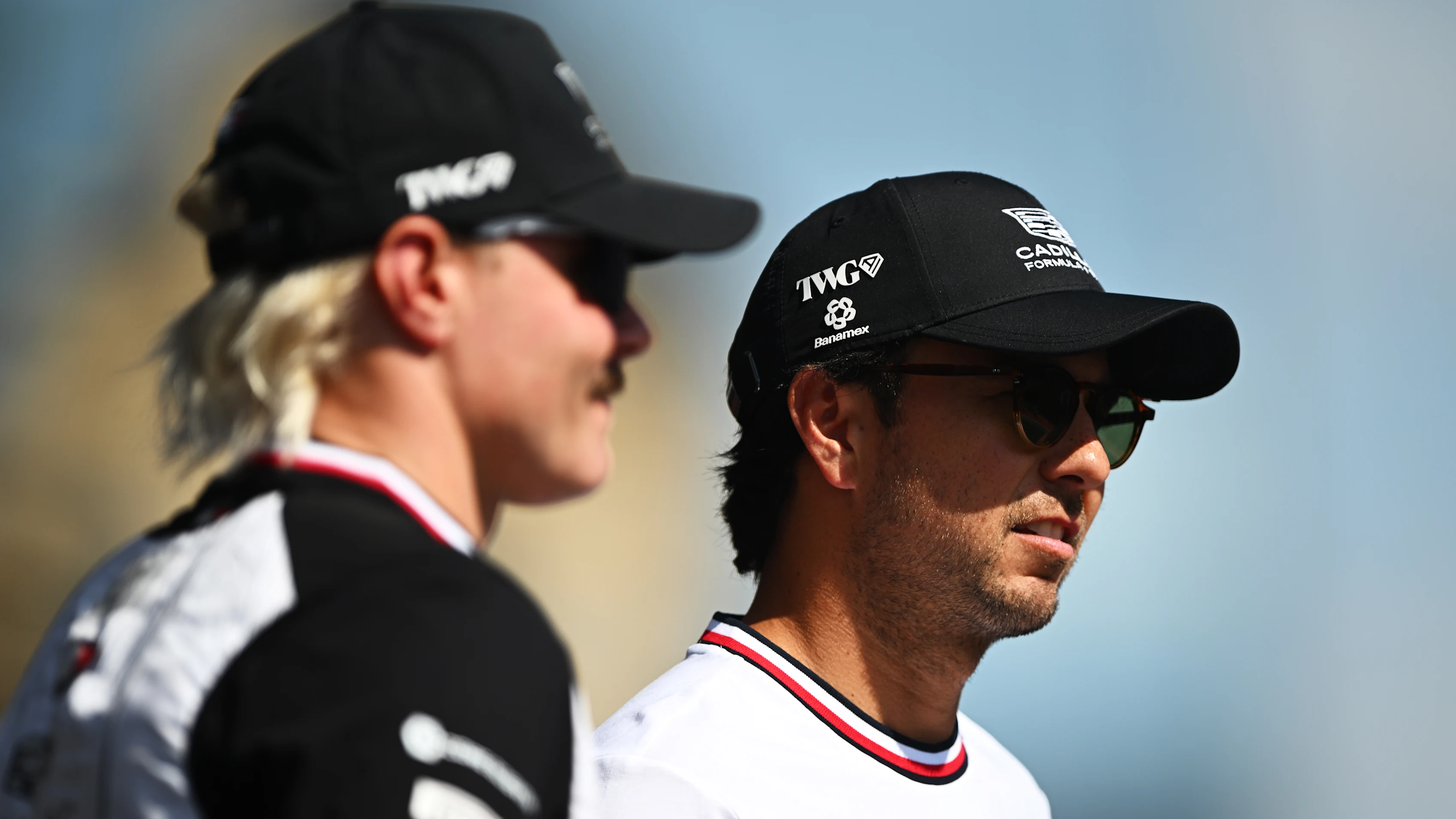 BAKU, AZERBAIJAN - SEPTEMBER 26: Sergio Perez of Mexico and Cadillac F1 Team and Valtteri Bottas of