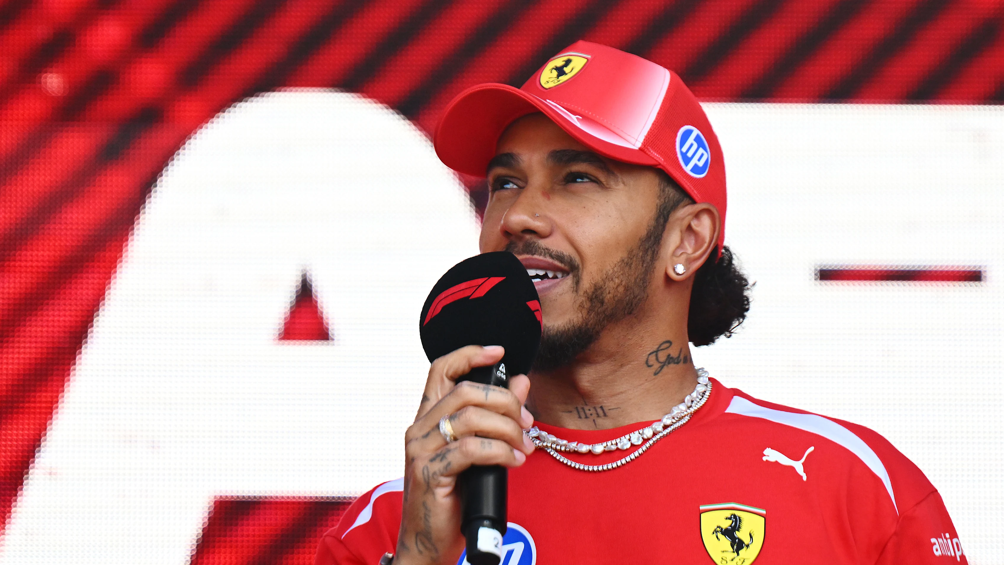 SPA, BELGIUM - JULY 17: Lewis Hamilton of Great Britain and Scuderia Ferrari on stage prior to