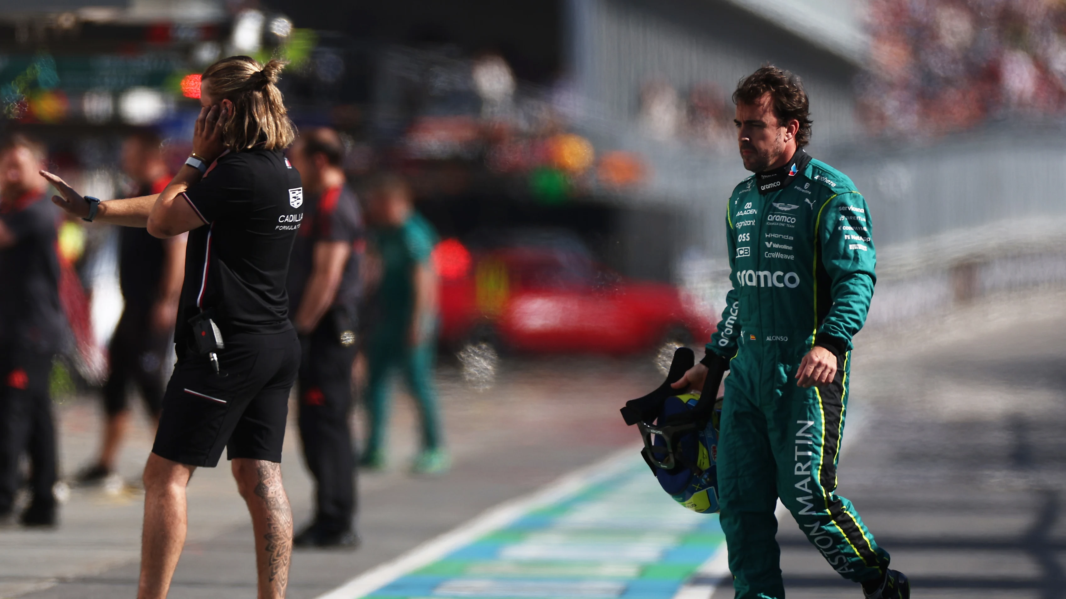 MONTREAL, QUEBEC - MAY 22: Fernando Alonso of Spain and Aston Martin F1 Team walks in the Pitlane