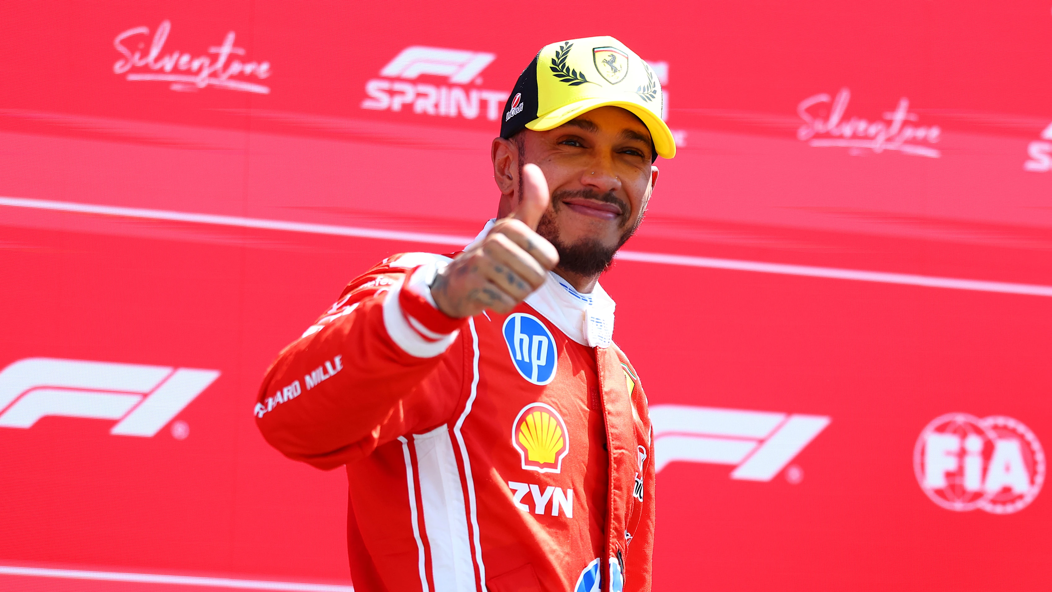 NORTHAMPTON, ENGLAND - JULY 04: Second placed Lewis Hamilton of Great Britain and Scuderia Ferrari