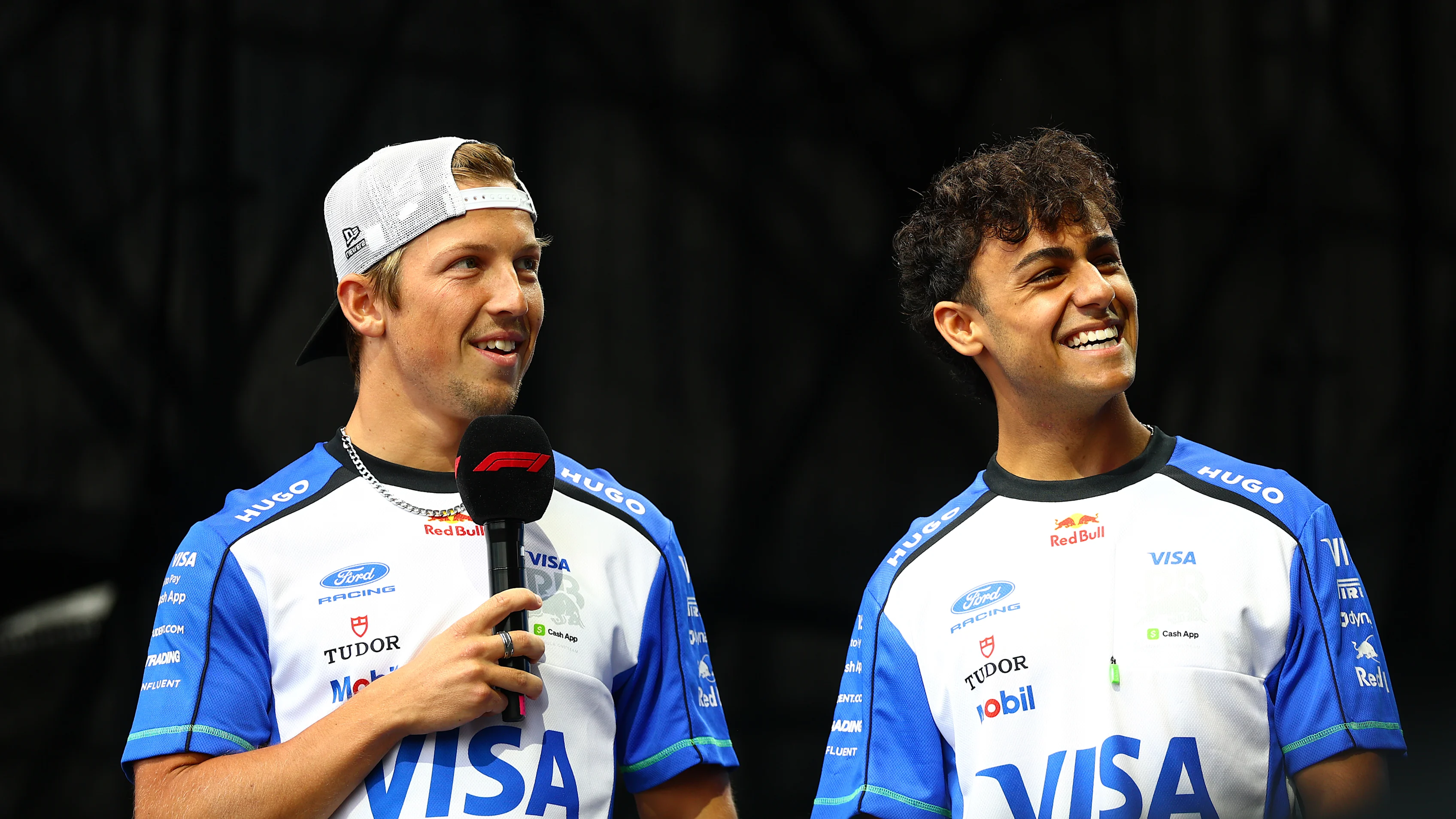 BUDAPEST, HUNGARY - JULY 24: Liam Lawson of New Zealand and Visa Cash App Racing Bulls talks to the