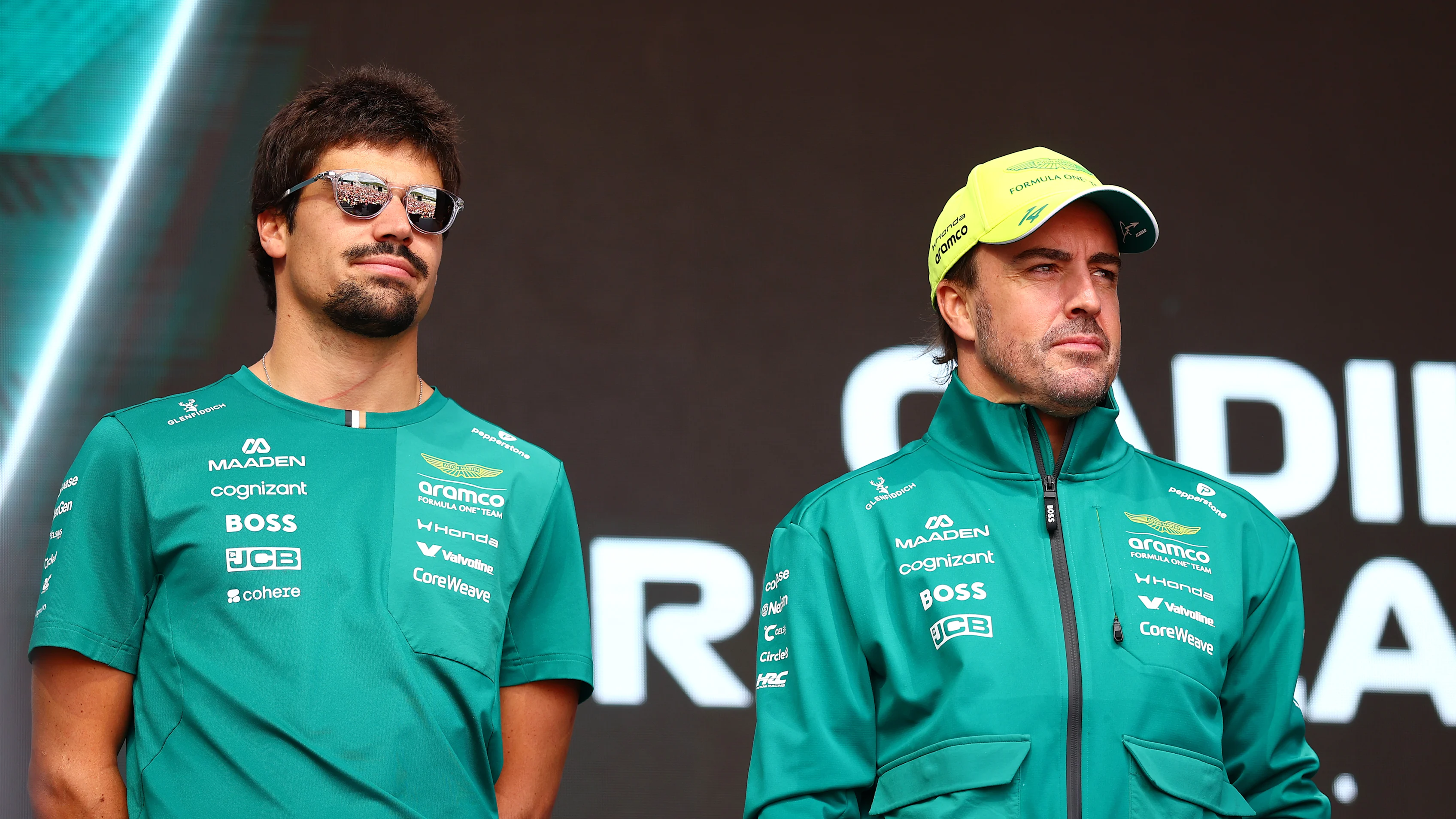 BUDAPEST, HUNGARY - JULY 24: Lance Stroll of Canada and Aston Martin F1 Team and Fernando Alonso of