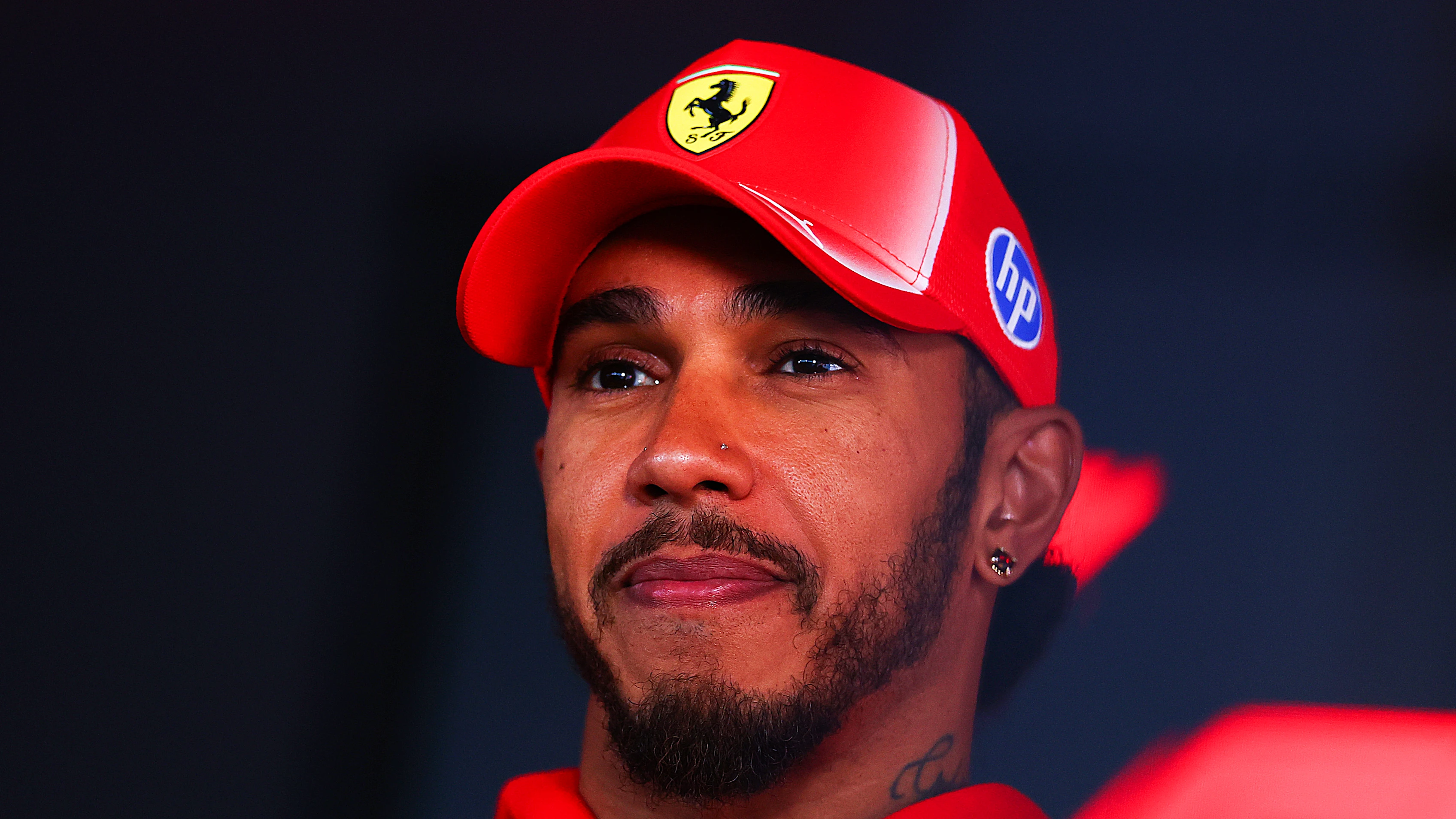 BUDAPEST, HUNGARY - JULY 23: Lewis Hamilton of Great Britain and Scuderia Ferrari talks to the