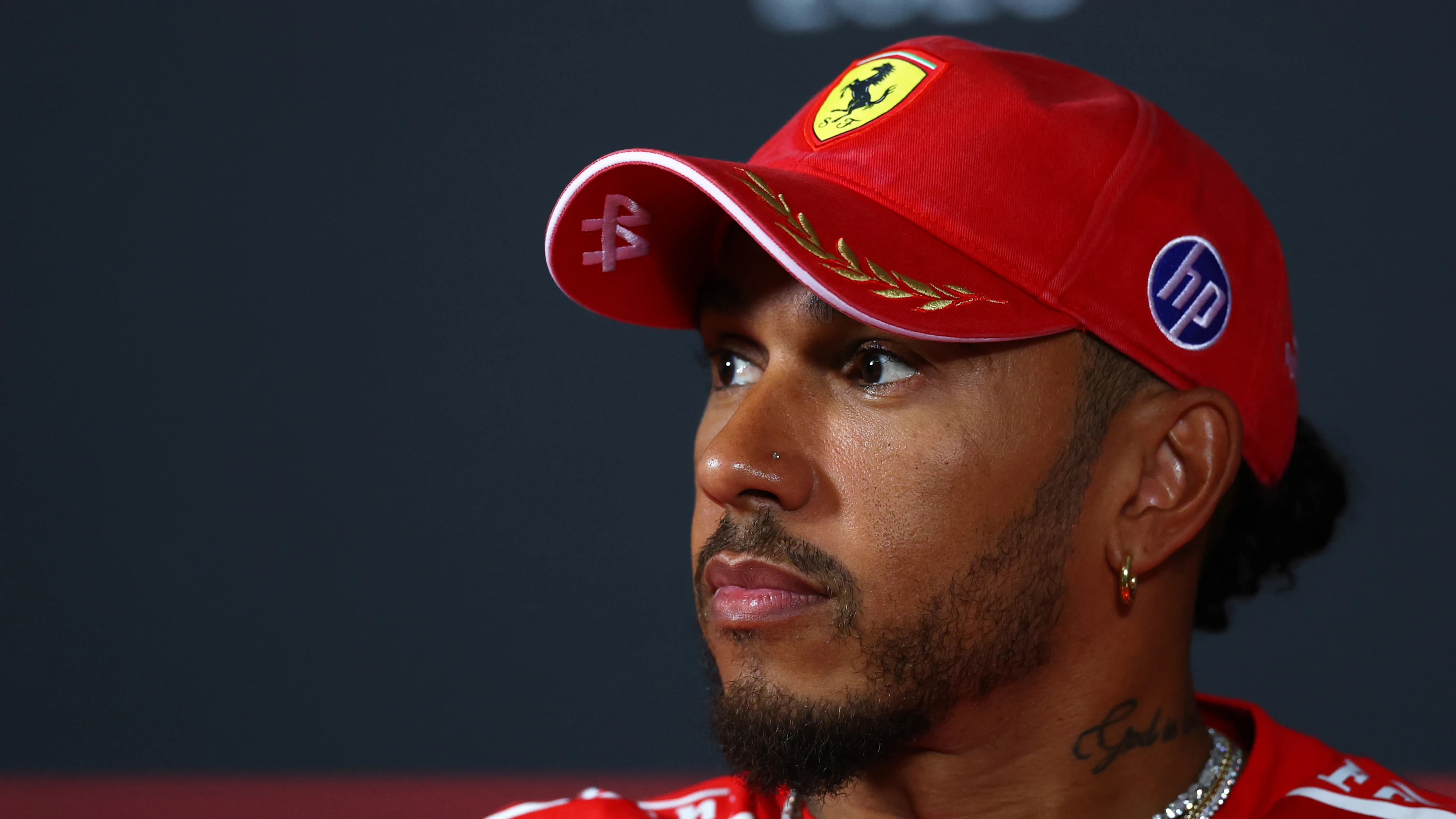 MONZA, ITALY - SEPTEMBER 03: Lewis Hamilton of Great Britain and Scuderia Ferrari looks on in the